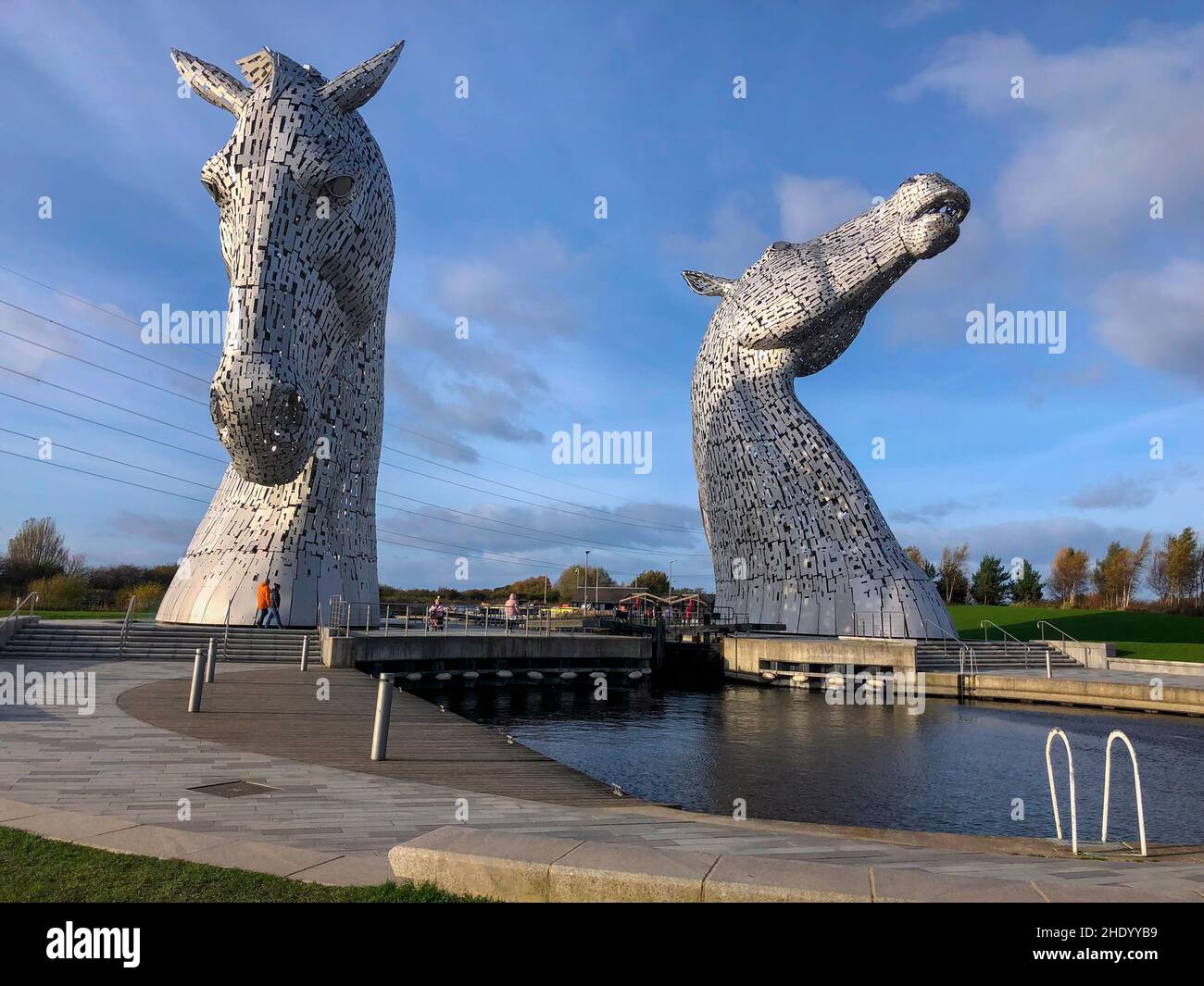 The Kelpies in Falkirk, Scotland. Two 30m high (98ft) horse-head sculptures depicting kelpies (shape-shifting water spirits). They stand next to a new Stock Photo