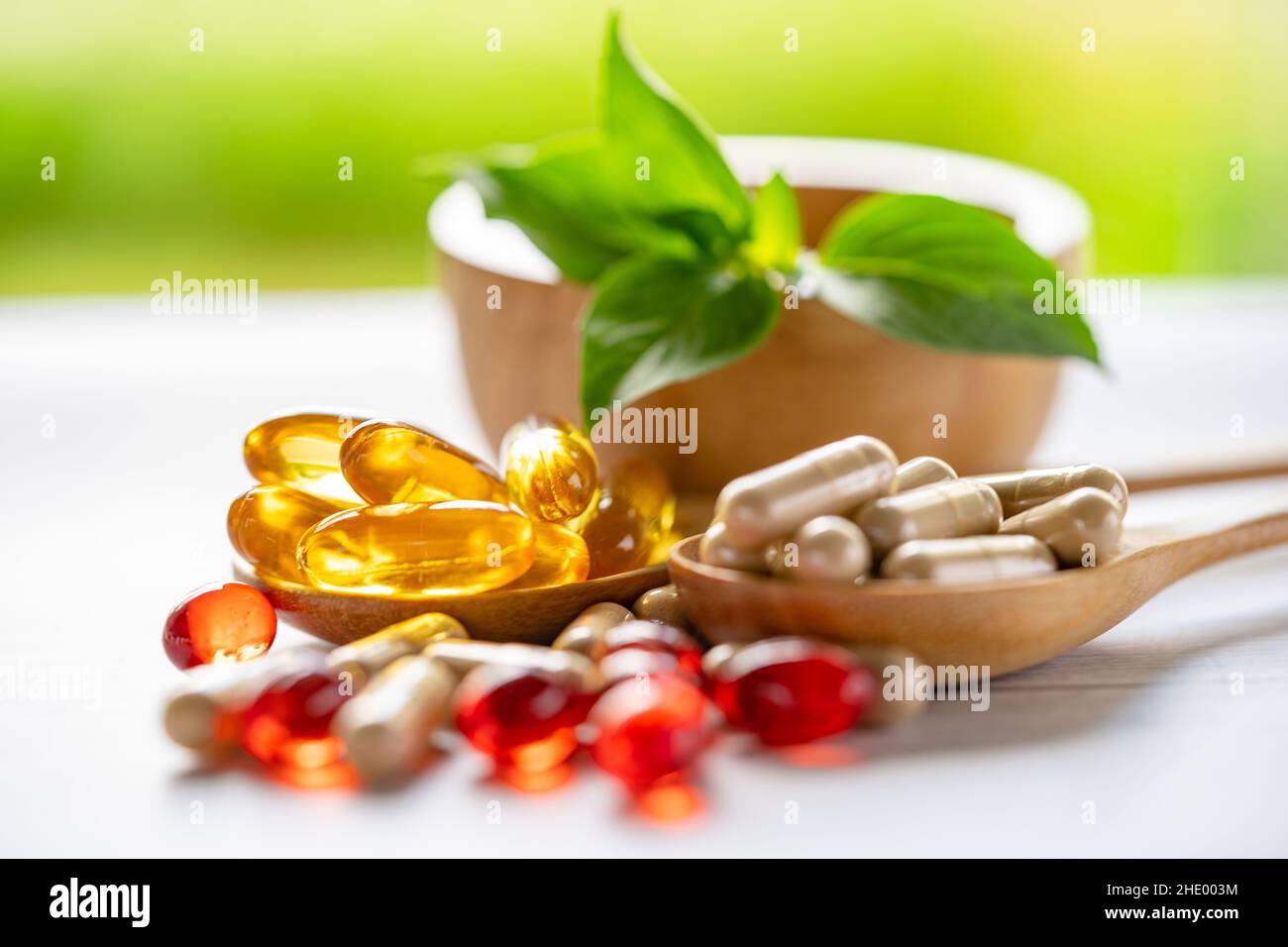 Alternative medicine nature herbal organic capsule, drug with herbs leaf natural supplements for healthy good life. Stock Photo