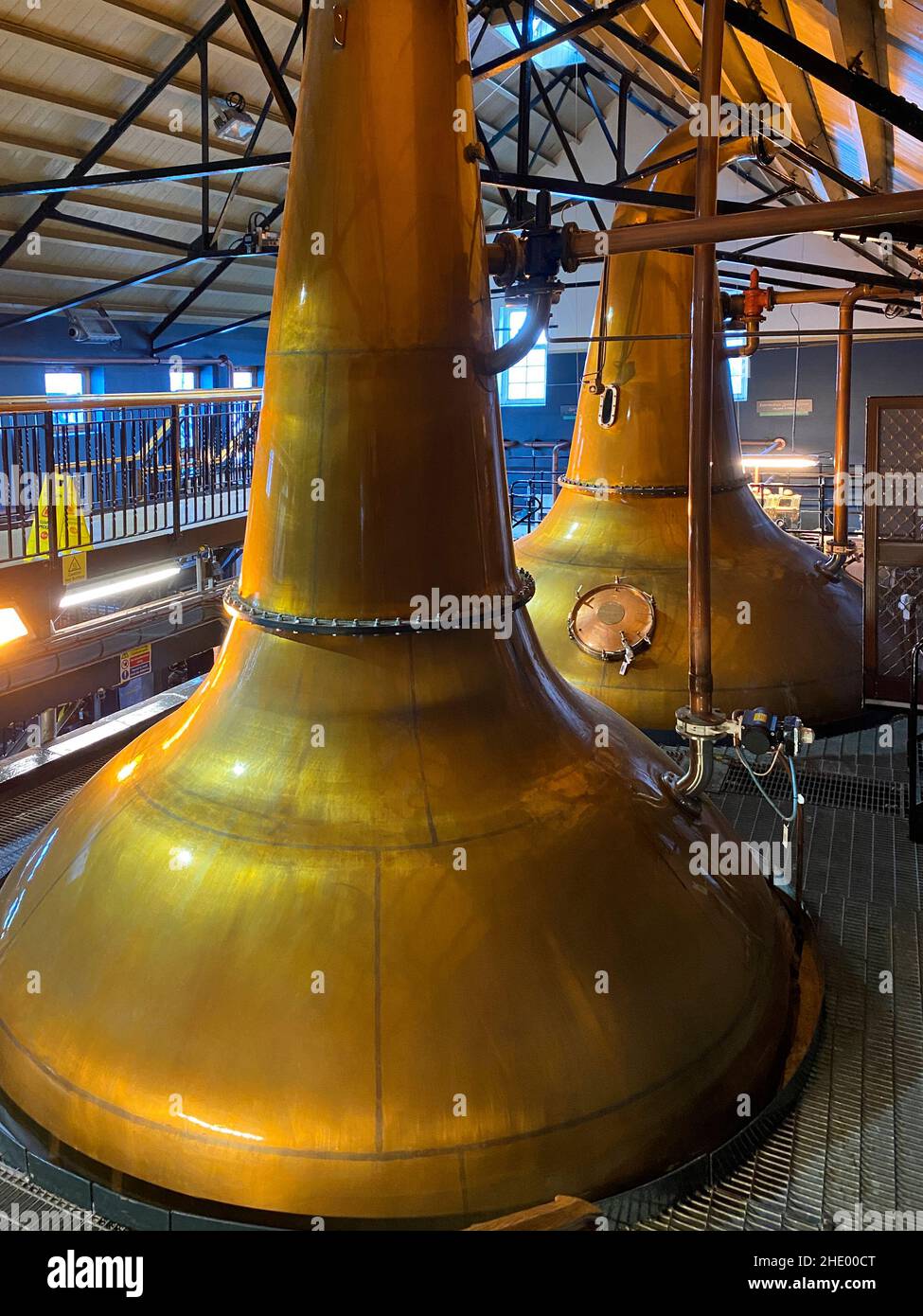 Copper pot stills used in the production of Single Malt Scotch Whisky. Dalwhinnie Whisky Distillery in the Highland village of Dalwhinnie in Scotland. Stock Photo