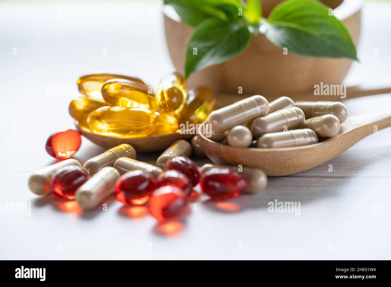 Alternative medicine nature herbal organic capsule, drug with herbs leaf natural supplements for healthy good life. Stock Photo