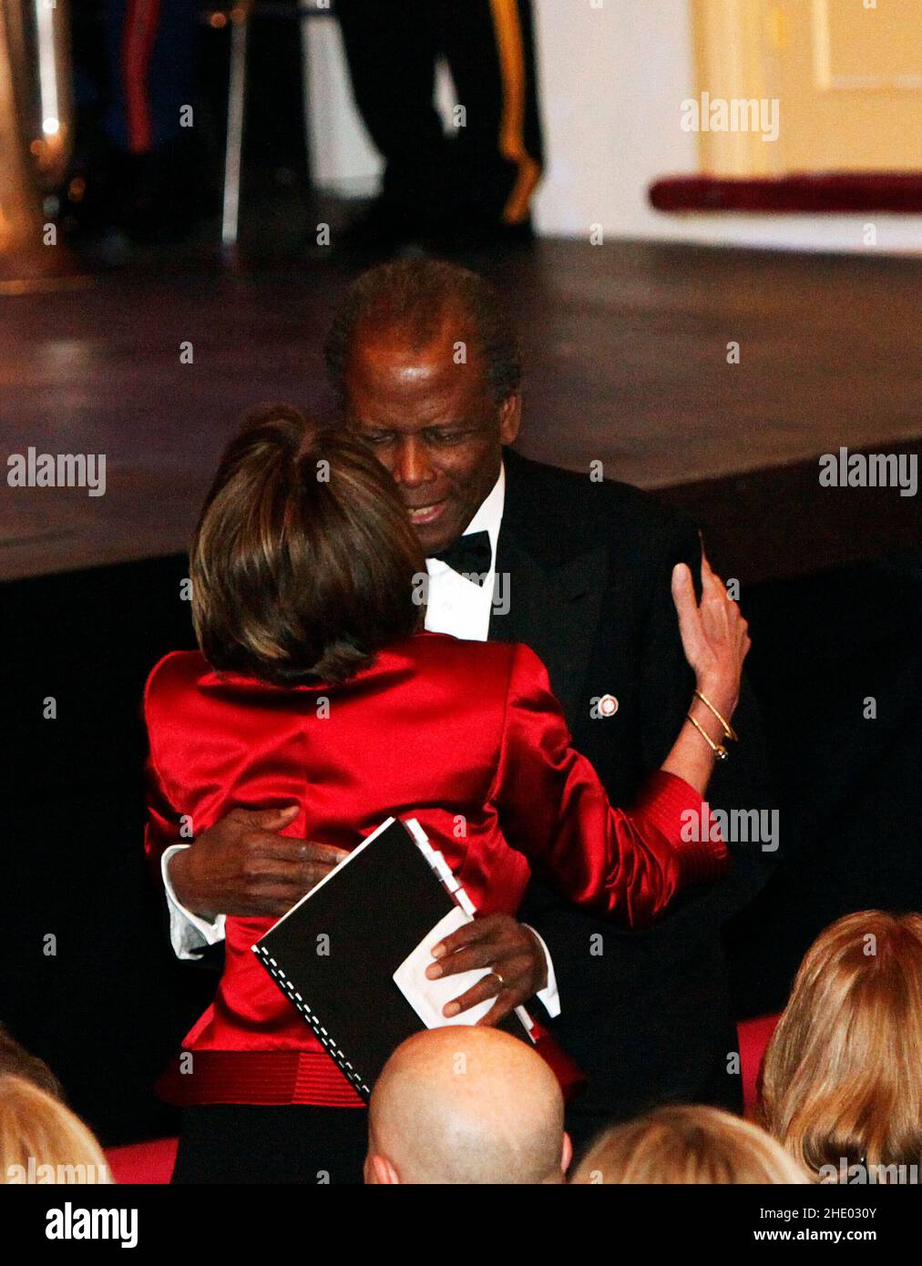 Washington, DC - February 11, 2009 -- United States Speaker of the House Nancy Pelosi (Democrat of California), greets actor Sydney Poitier at the Ford's Theater reopening celebration, Washington, DC, Wednesday, February 11, 2009. The theater underwent an 18 month renovation.Credit: Aude Guerrucci - Pool via CNP Stock Photo