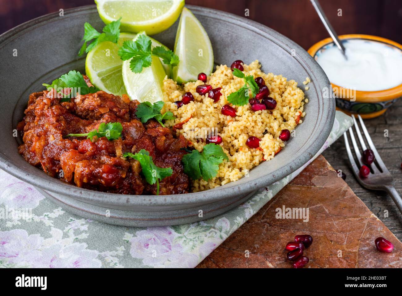 Moroccan lamb tagine with lemon and pomegranate couscous Stock Photo