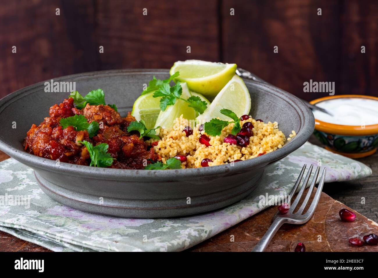 Moroccan lamb tagine with lemon and pomegranate couscous Stock Photo