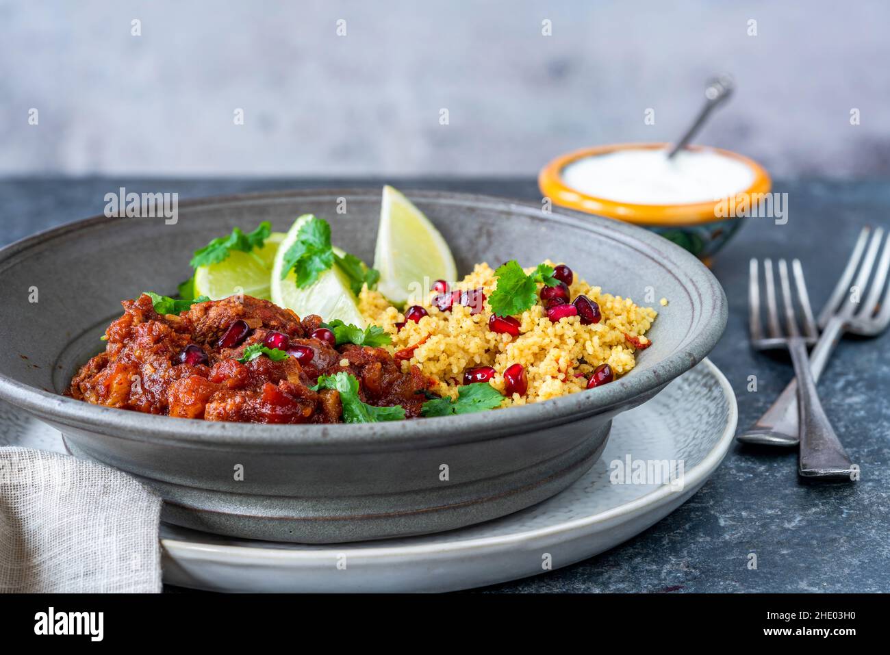 Moroccan lamb tagine with lemon and pomegranate couscous Stock Photo
