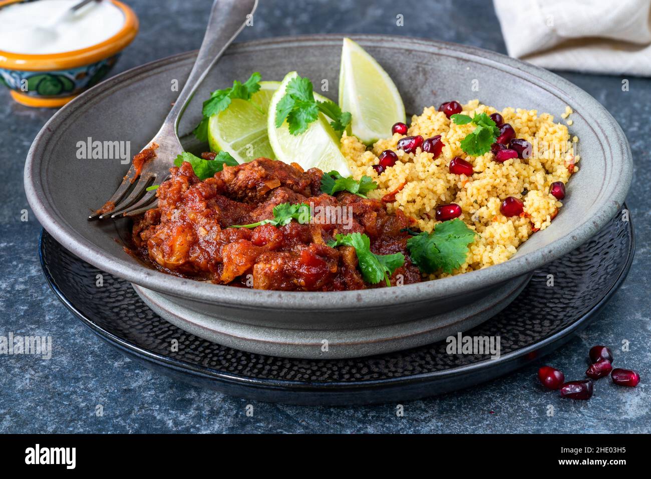 Moroccan lamb tagine with lemon and pomegranate couscous Stock Photo