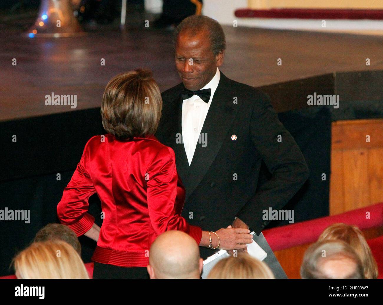 File photo - Washington, DC - February 11, 2009 -- United States Speaker of the House Nancy Pelosi (Democrat of California), greets actor Sydney Poitier at the Ford's Theater reopening celebration, Washington, DC, Wednesday, February 11, 2009. The theater underwent an 18 month renovation. - Sidney Poitier, legend and first black best actor Oscar winner, dead at 94. Photo by Aude Guerrucci - Pool via CNP /ABACAPRESS.COM Credit: Abaca Press/Alamy Live News Stock Photo