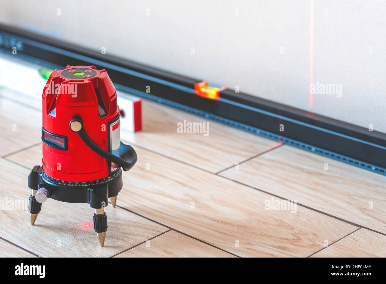 Laser level and Bubble levels, lines on the wall. measuring with red
