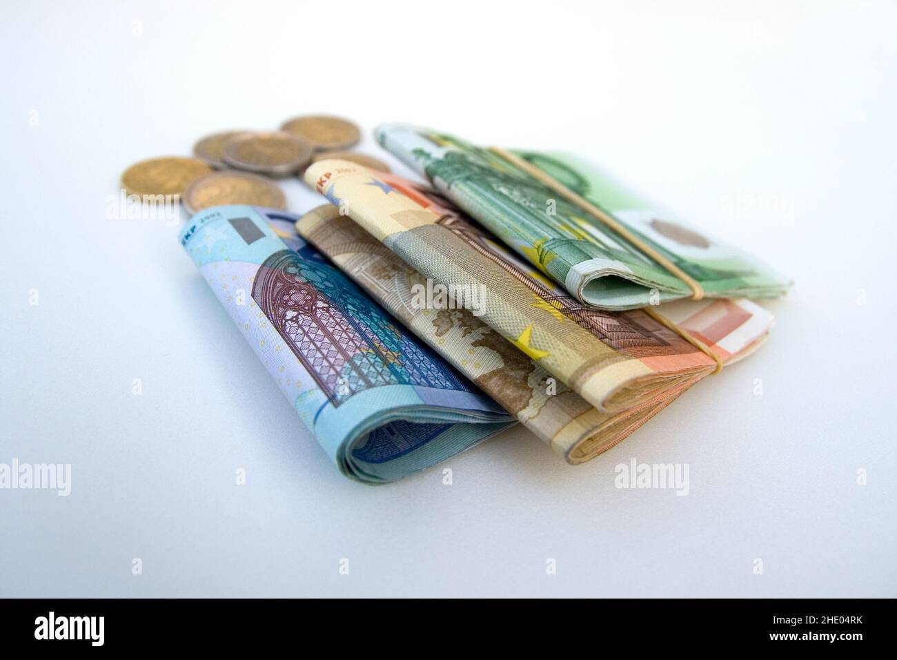 Euro banknotes and coins isolated on white background Stock Photo
