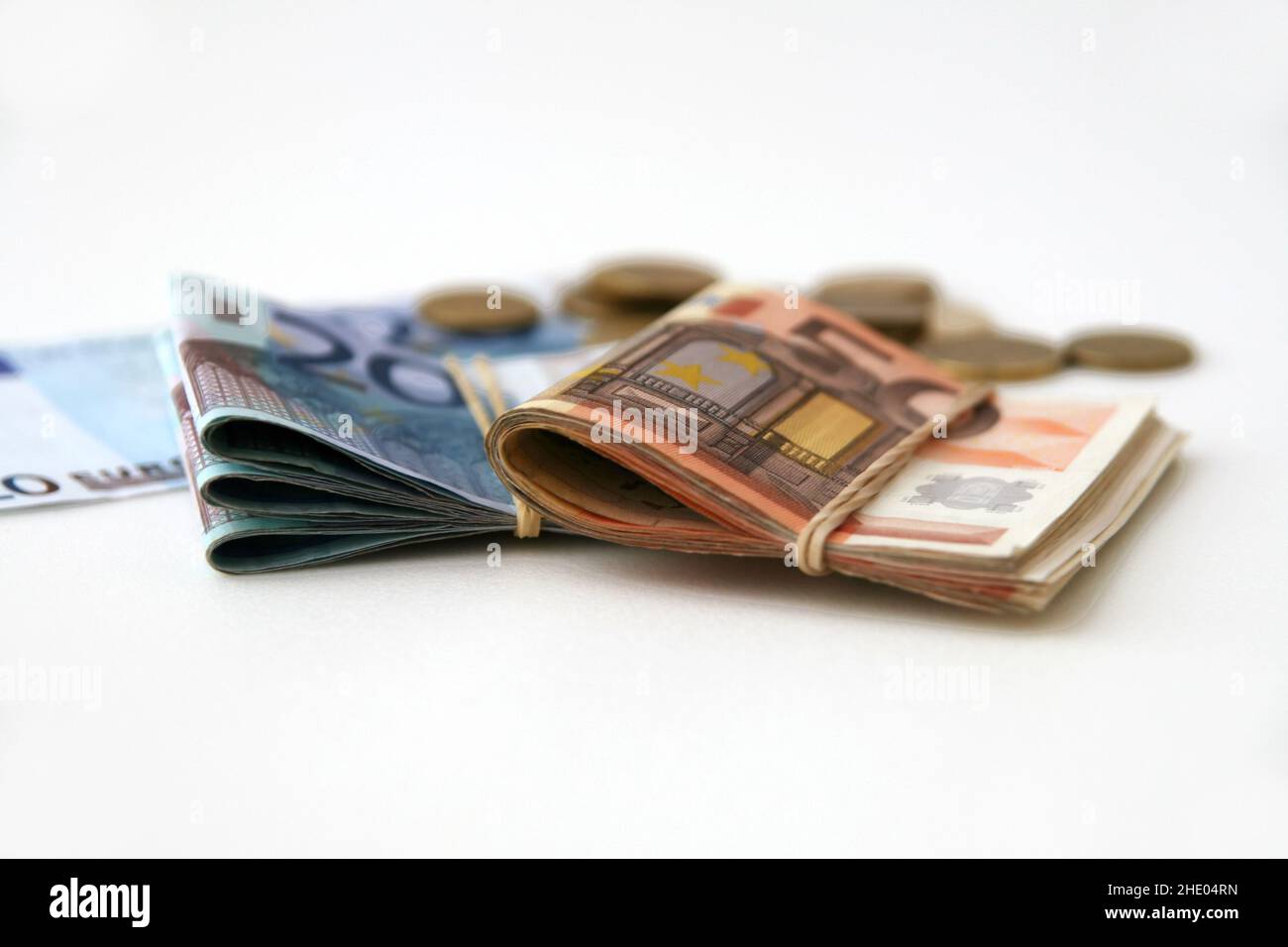 Euro banknotes and coins isolated on white background Stock Photo - Alamy