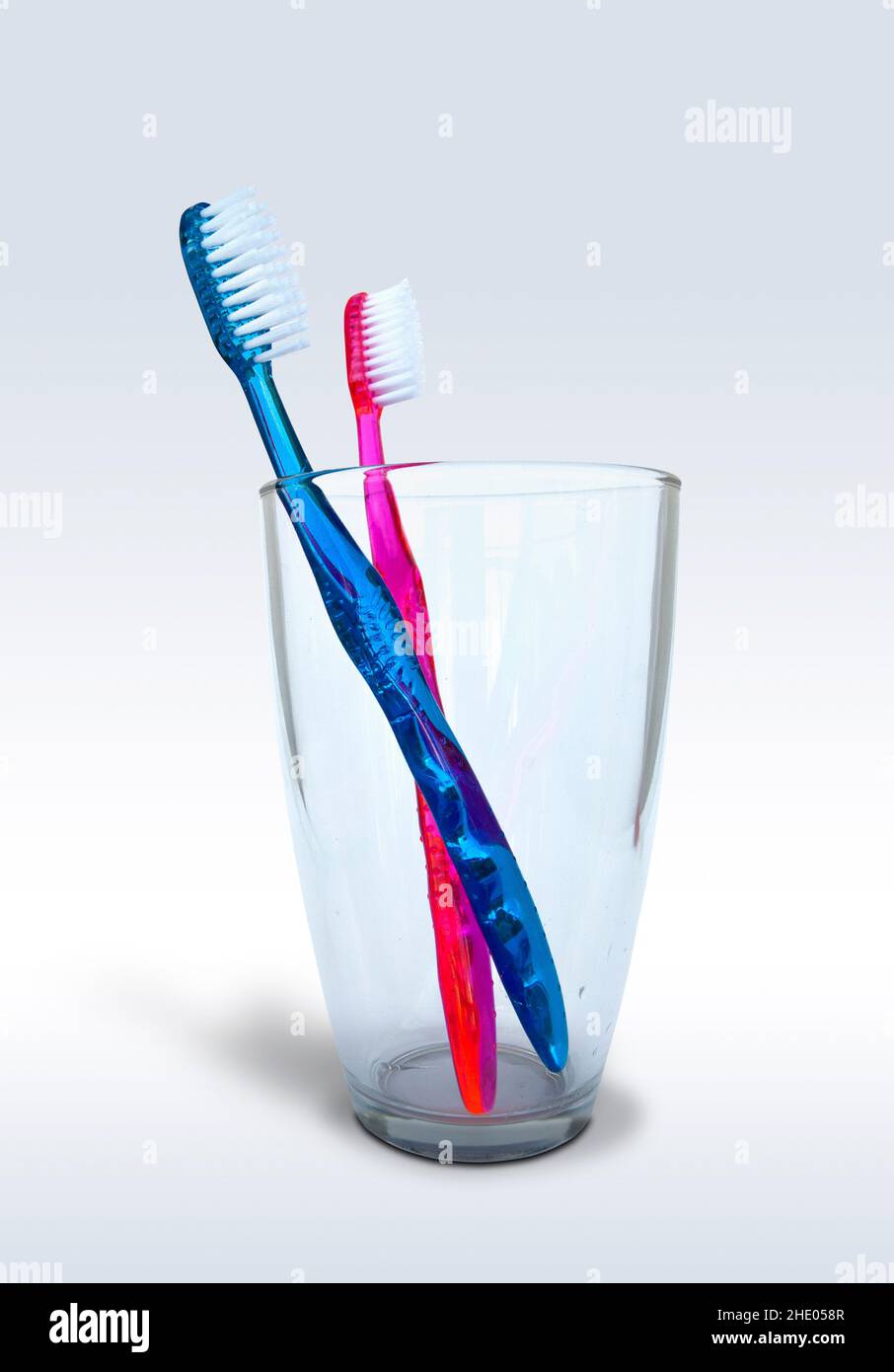 Tooth brushes in a glass isolated on white background Stock Photo