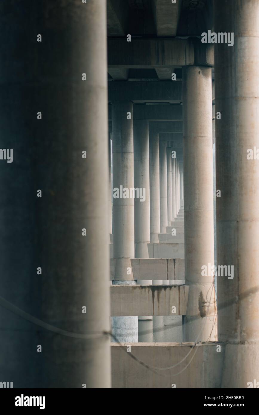 Vertical shot of a bridge with concrete columns Stock Photo