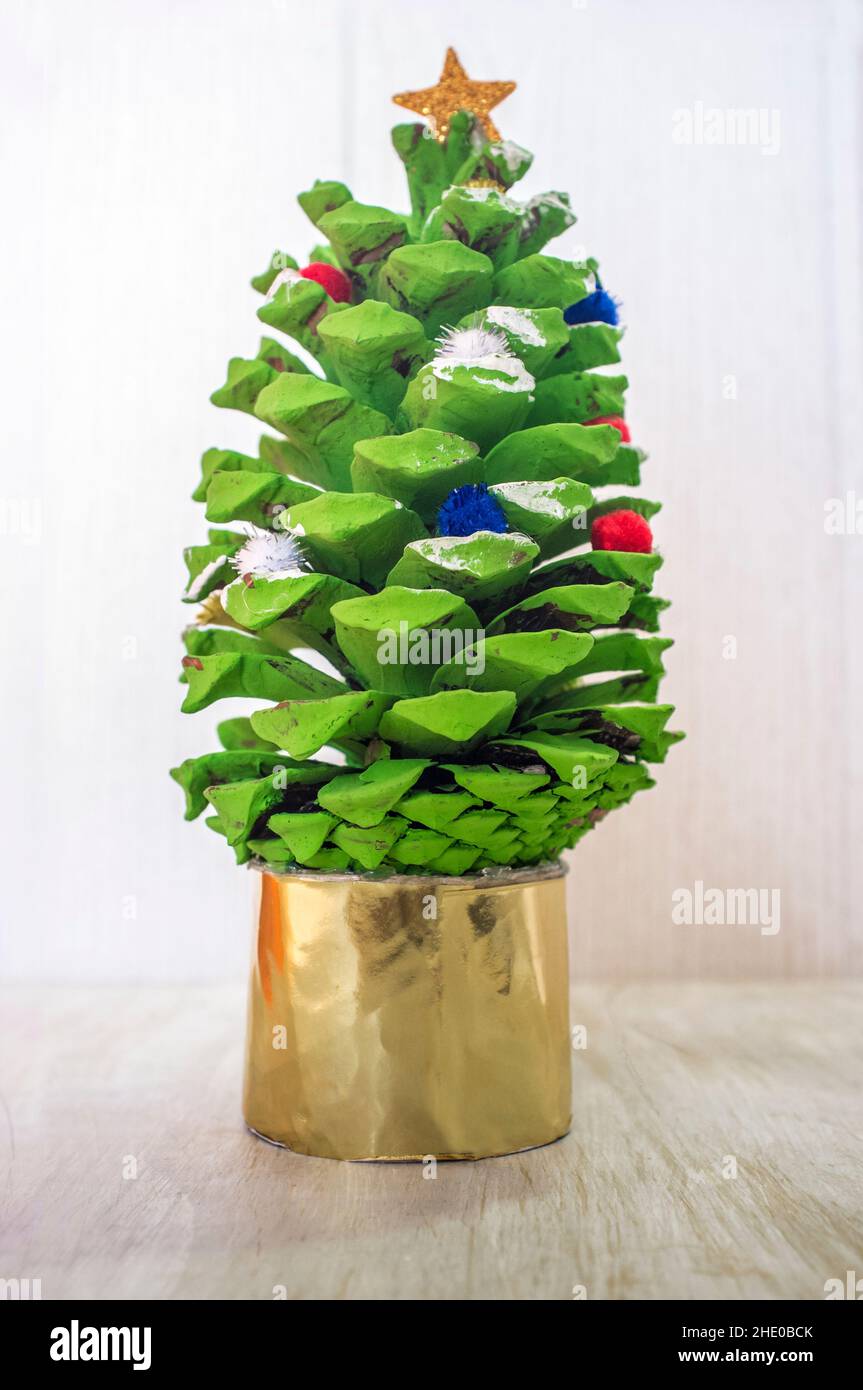 Christmas tree made with painted pine cone. Christmas crafts made with