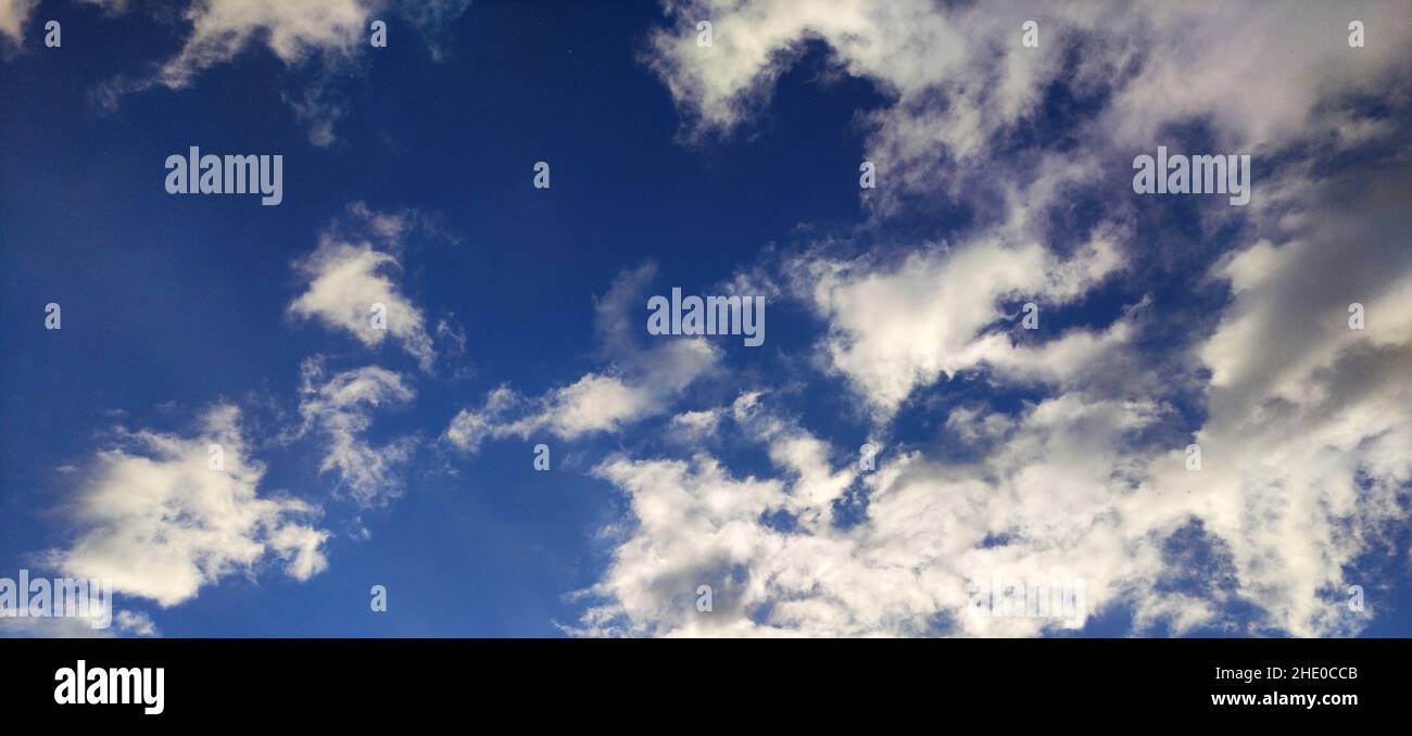 Deep blue sky with white clouds background, natural wallpaper Stock ...