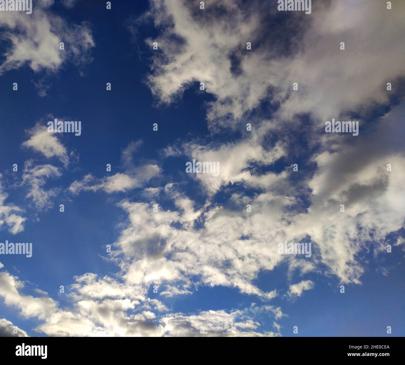 Deep blue sky with white clouds background, natural wallpaper Stock ...