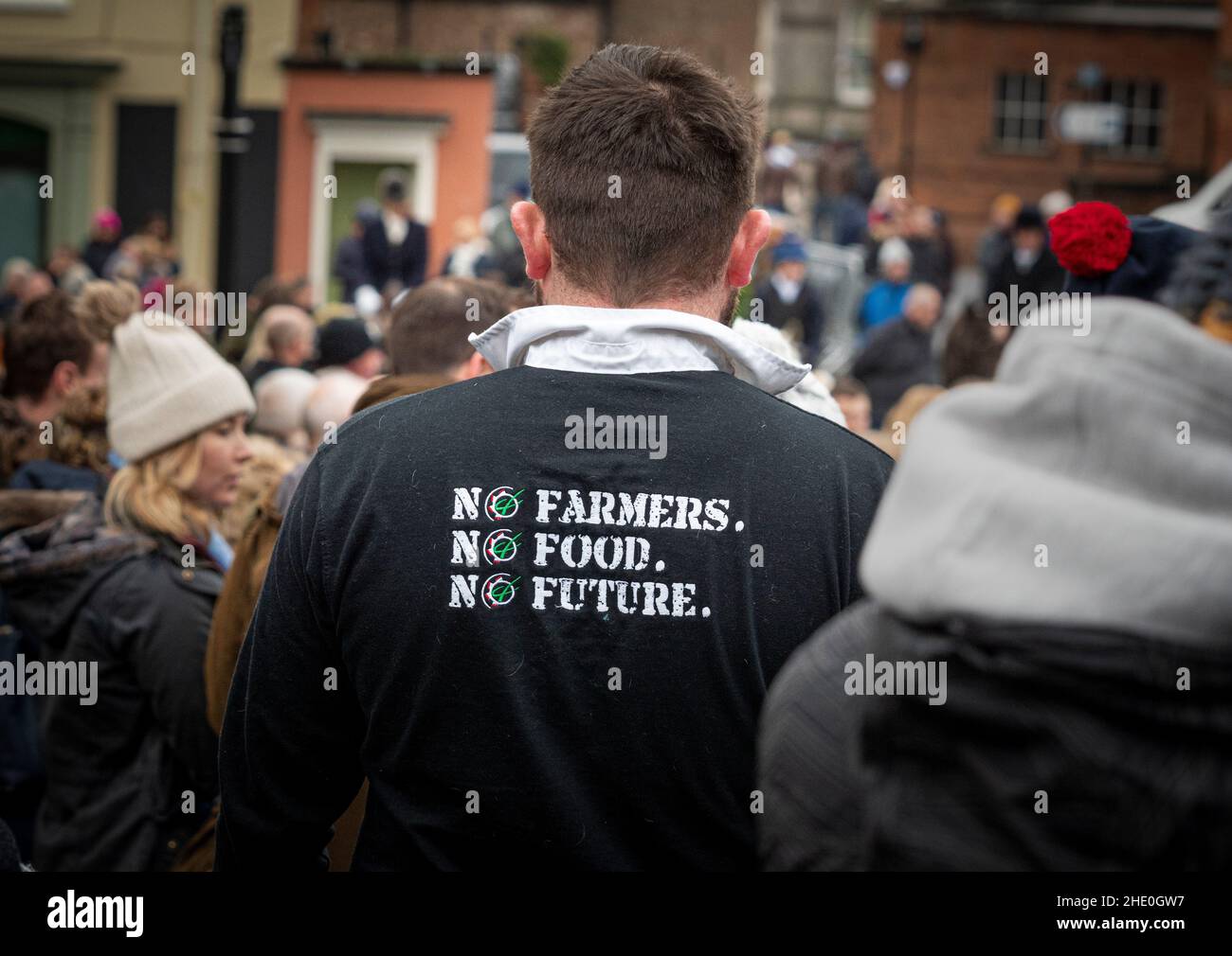 No farmers. No Food. No future. Slogan on the back of a black rugby shirt worn by a spectator in Malton at start of the Middleton Boxing day hunt. Stock Photo