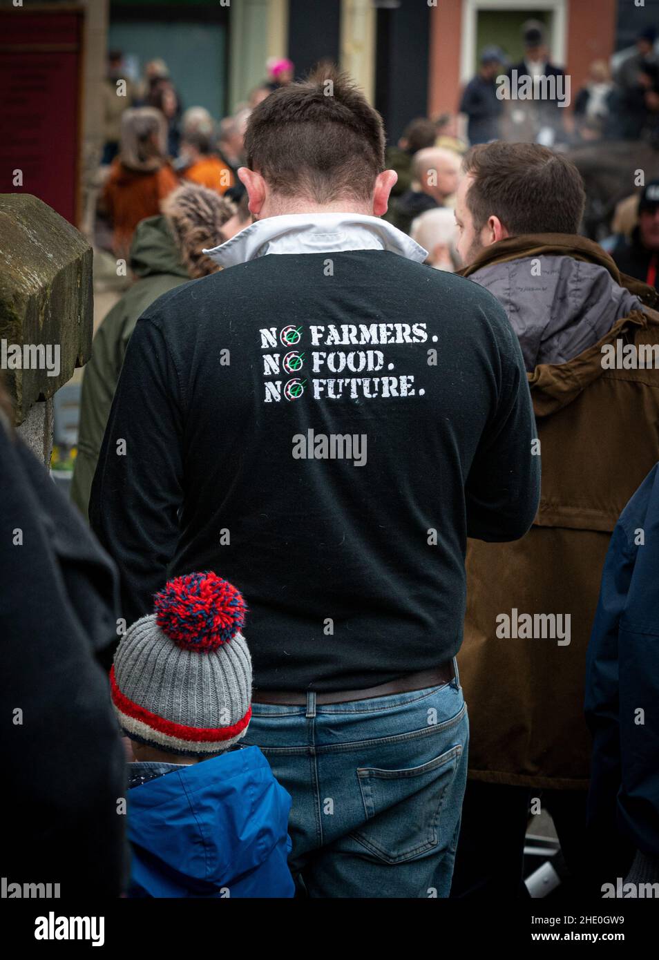 No farmers. No Food. No future. Slogan on the back of a black rugby shirt worn by a spectator in Malton at start of the Middleton Boxing day hunt. Stock Photo