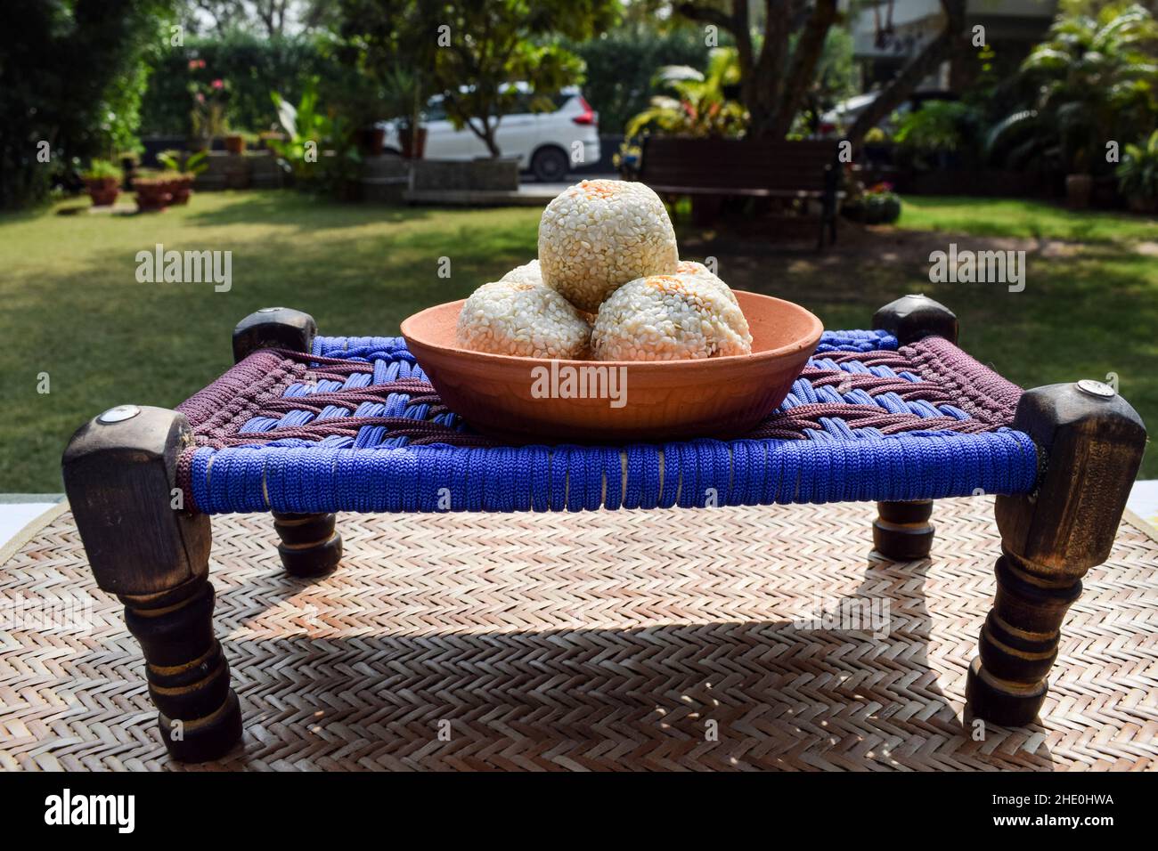 Tilgul ladoo recipe. white sesame seeds coated with jaggery sugar. Indian sweet balls served eaten Indian traditional mithai til bati Stock Photo