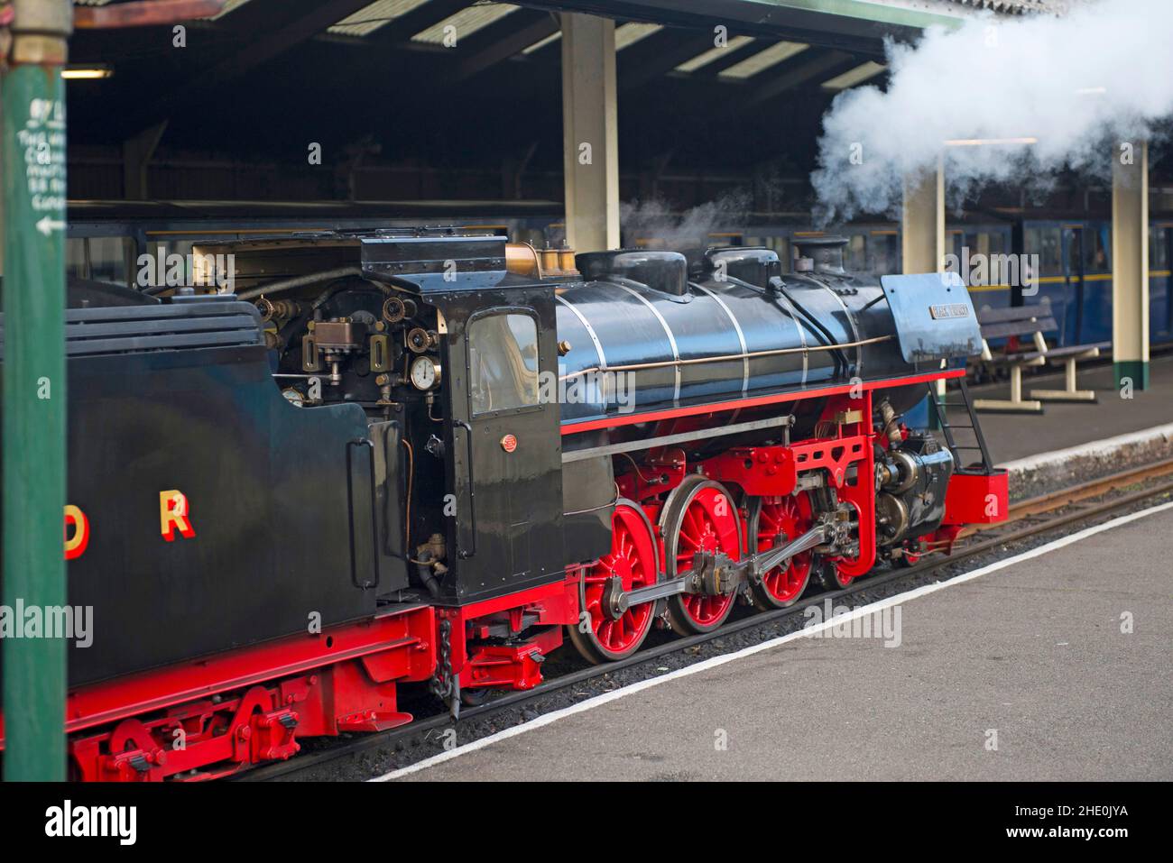 A steam locomotive heading a train on the famous 15inch gauge Romney Hythe and Dymchurch Railway at Dymchurch Stock Photo