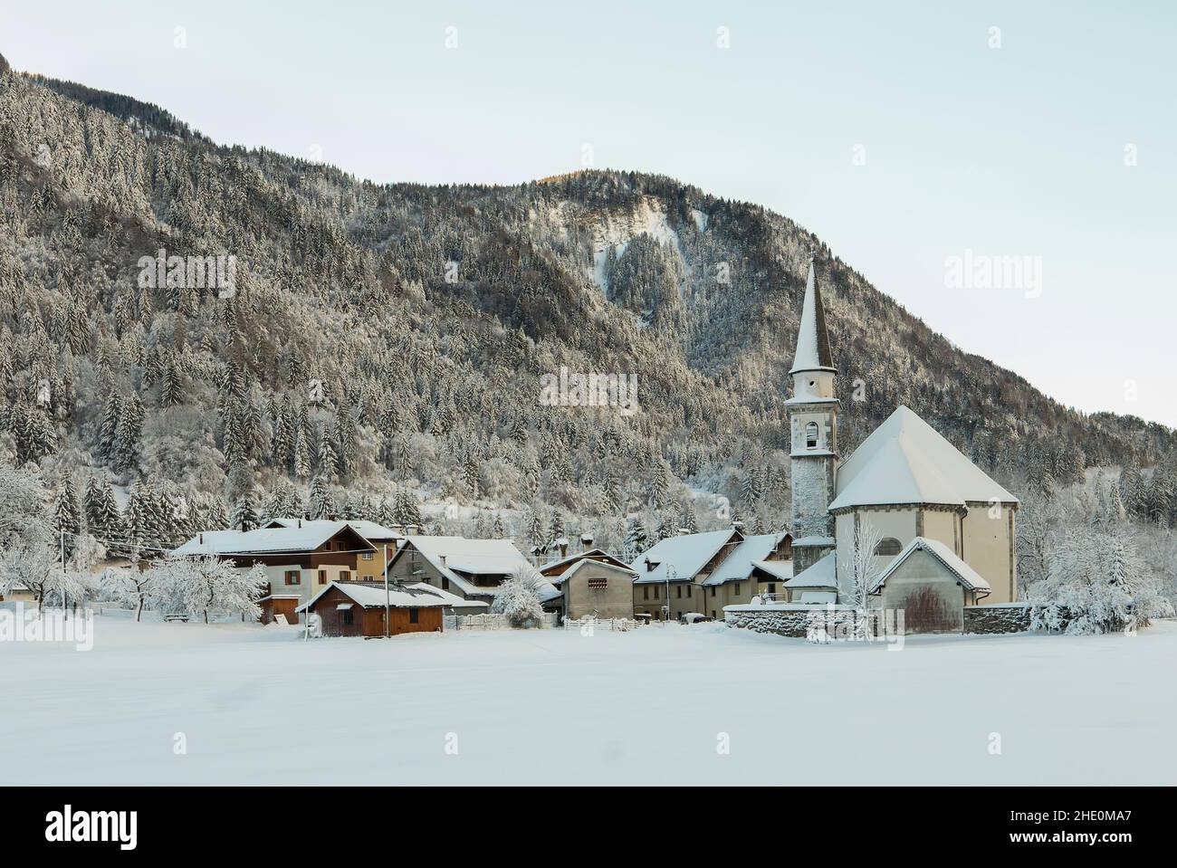 An enchanting winter view of the alpine village of Bagni di Lusnizza on the italian Alps Stock Photo