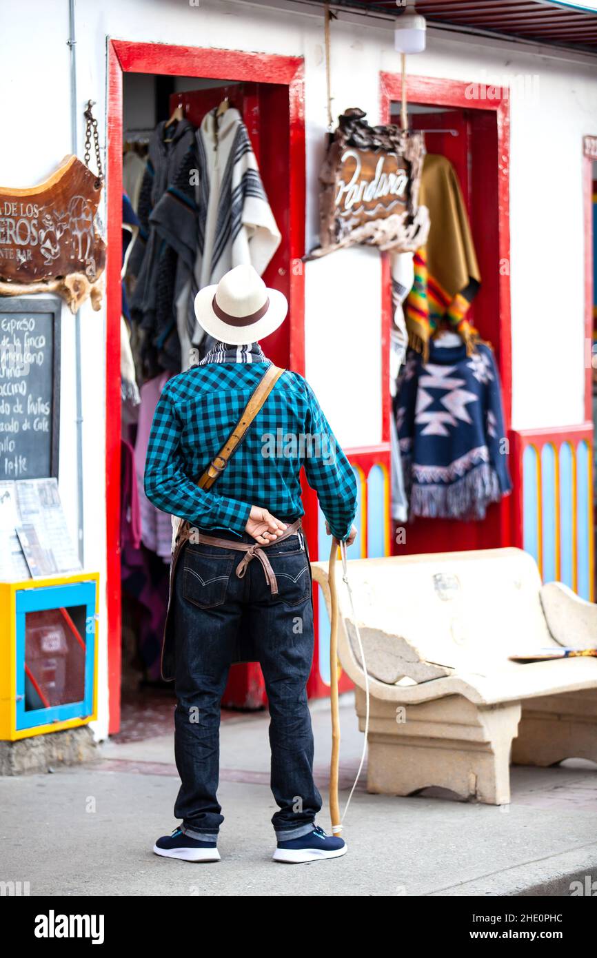 SALENTO, COLOMBIA - JULY 2021. Man dressed with the traditional outfit of the arrieros at the small town of Salento located at the region of Quindio i Stock Photo