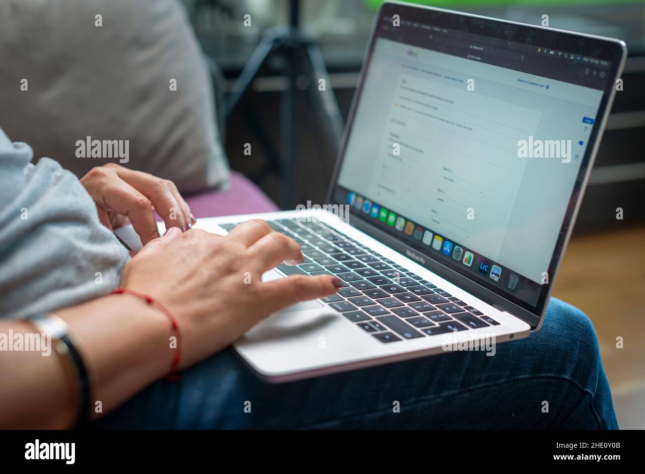 Woman works from home on laptop computer, London,UK Stock Photo