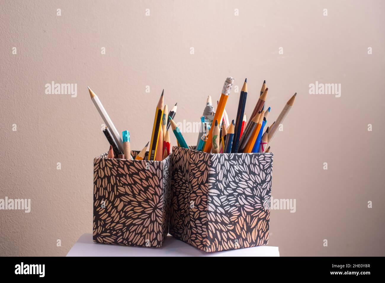 Two boxes of coloured pencils- selective focus Stock Photo