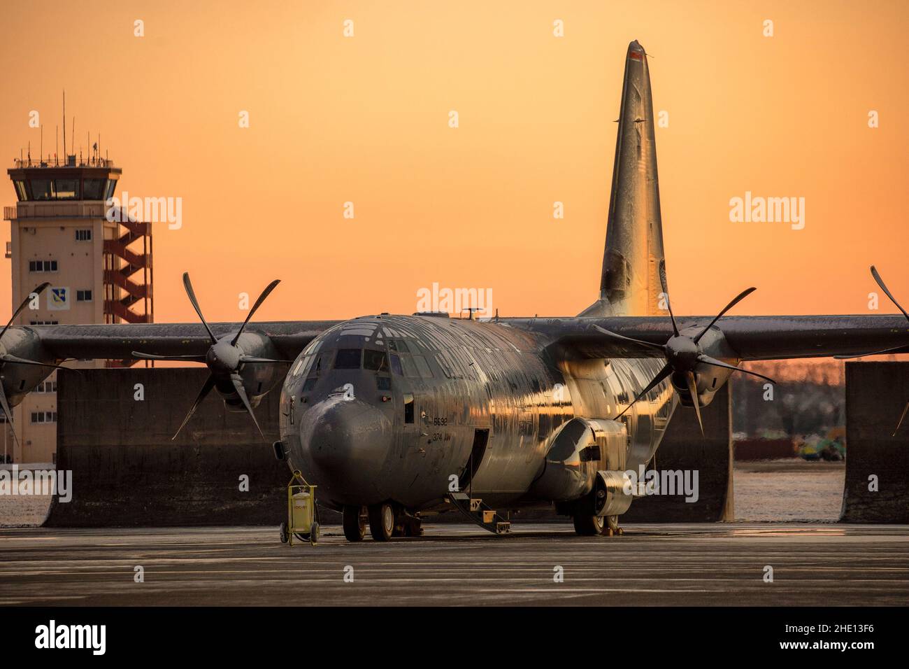 A C-130J Super Hercules assigned to the 36th Airlift Squadron sits on the flightline after de-icing by members of the 374th Aircraft Maintenance Squadron hydraulic section at Yokota Air Base, Japan, Jan. 7, 2022. Heavy snowfall hit Yokota and the Kanto Plain, accumulating 10 centimeters of snow in the evening, a level unseen in the past four years. (U.S. Air Force photo by Yasuo Osakabe) Stock Photo