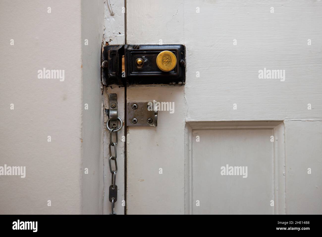 An antique old style night latch Yale type lock made by H & T VAUGHAN