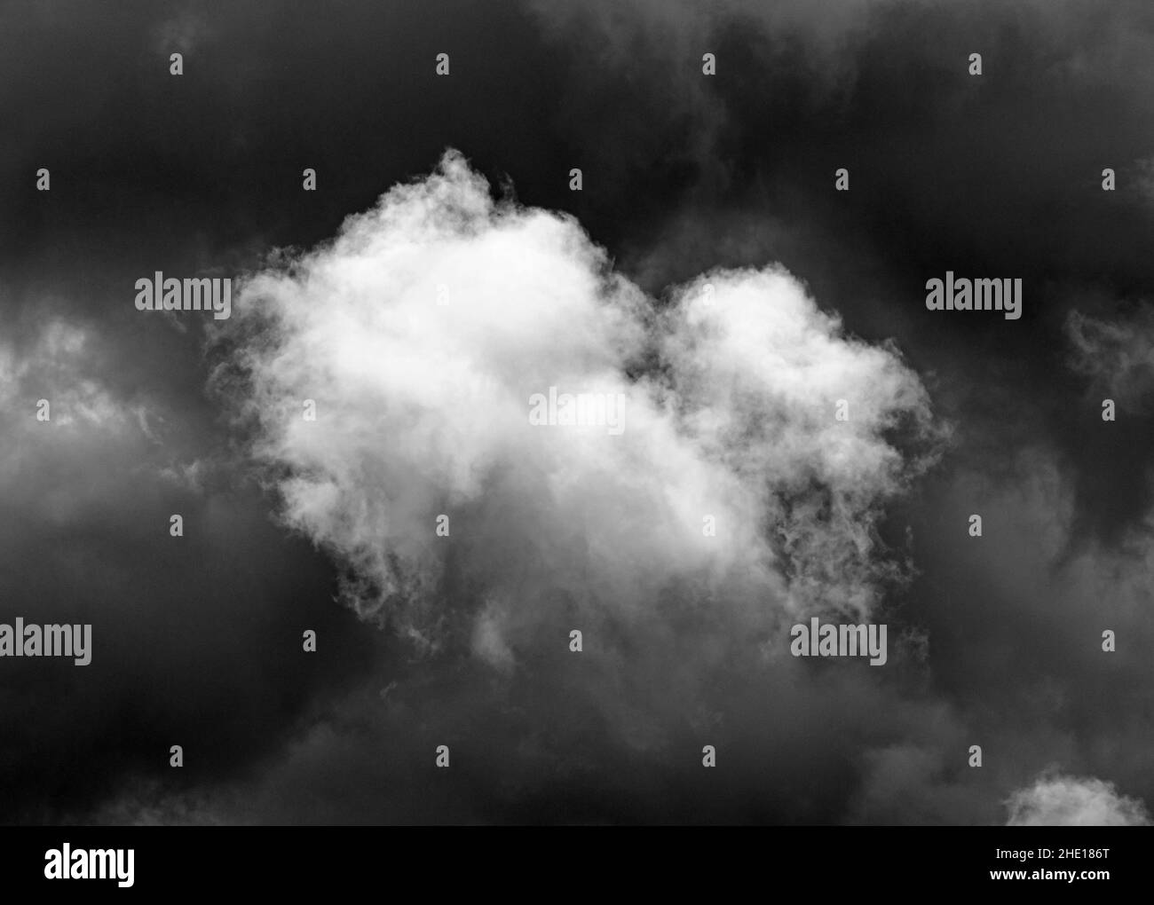 Grayscale of white cloud set in the light sky Stock Photo