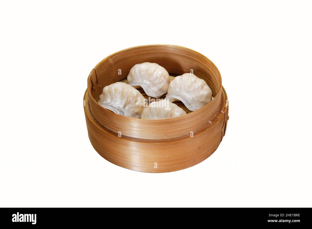 various types of dim sum in a bamboo container on a white background Stock Photo