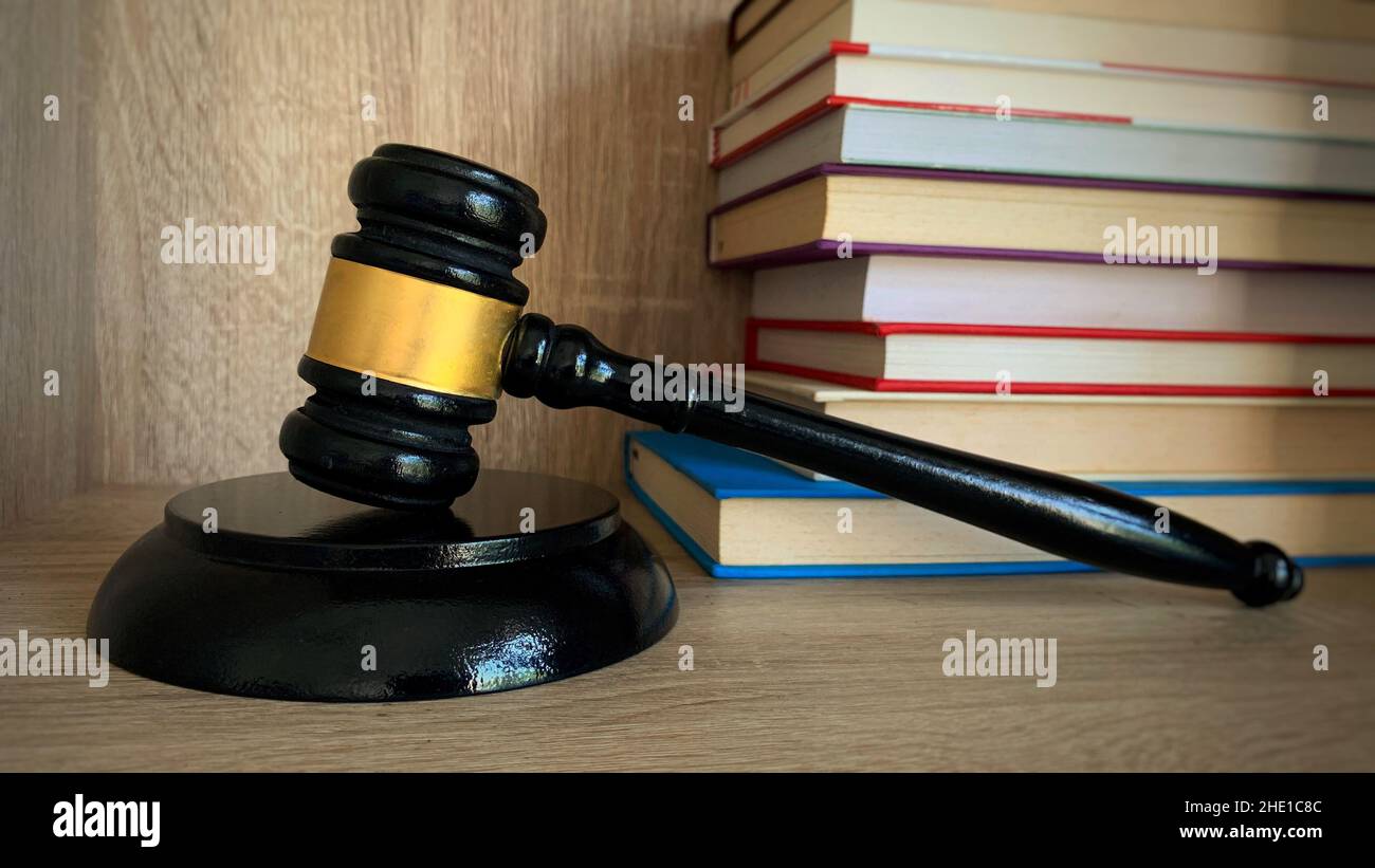 Law and Justice, legality concept. Judge gavel with books background. Stock Photo