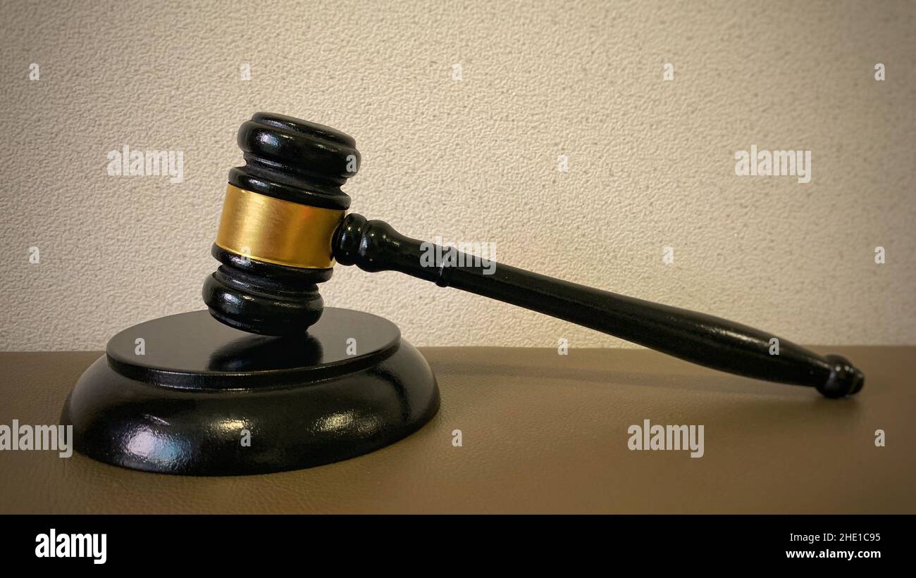 Judge gavel on brown background. Law concept. Stock Photo