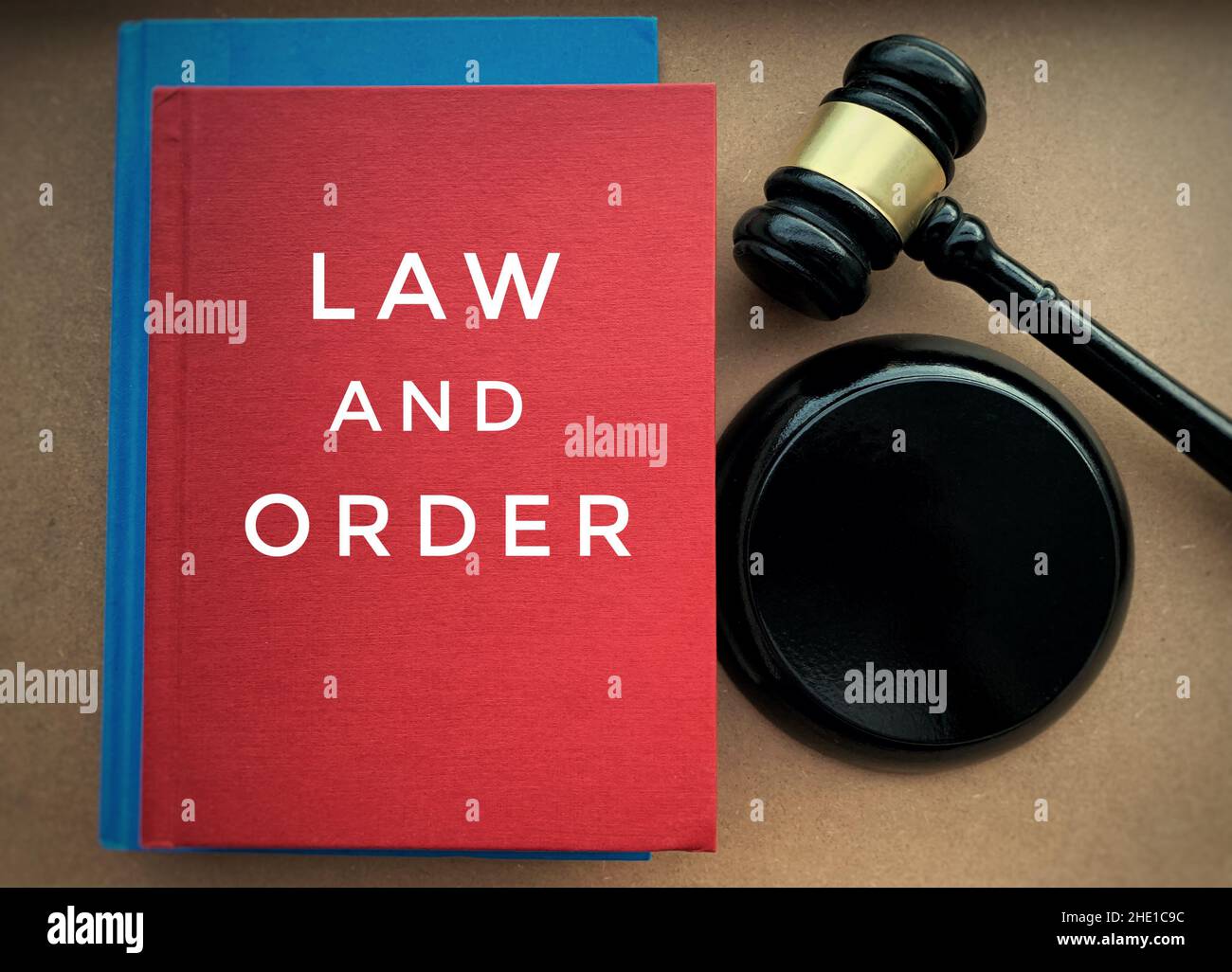 Law and order text on book cover with gavel hammer background. Law concept Stock Photo