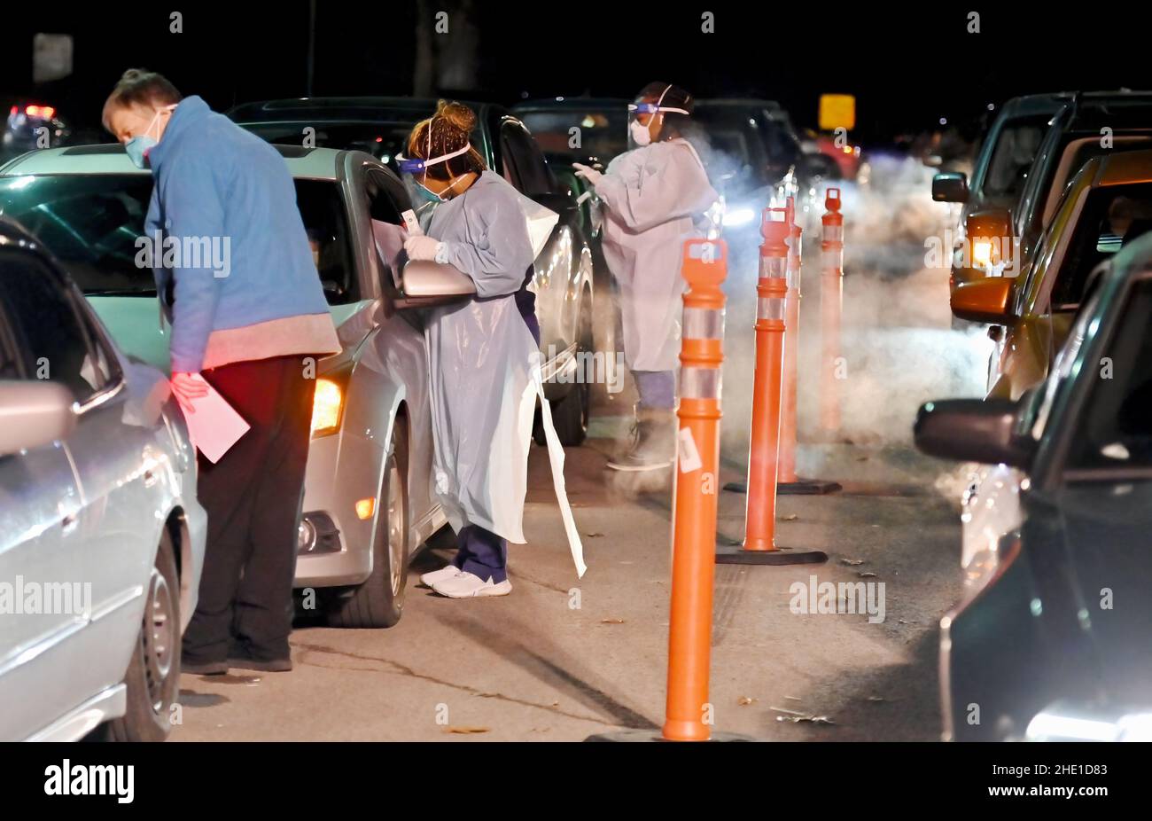Wilkes-Barre, Pennsylvania, USA. 6th Jan, 2022. A Health worker registers as others take swab samples from people at the drive thru Covid-19 testing site.With the new Omicron variant Covid-19 surge, testing sites are seeing long lines for testing. Employees from AMI Expeditionary Healthcare are seen in Pennsylvania giving Covid-19 tests. The group has been moving from hotel to hotel and working 12 hour days, 4-5 days a week to test community members for Covid-19. (Credit Image: © Aimee Dilger/SOPA Images via ZUMA Press Wire) Stock Photo