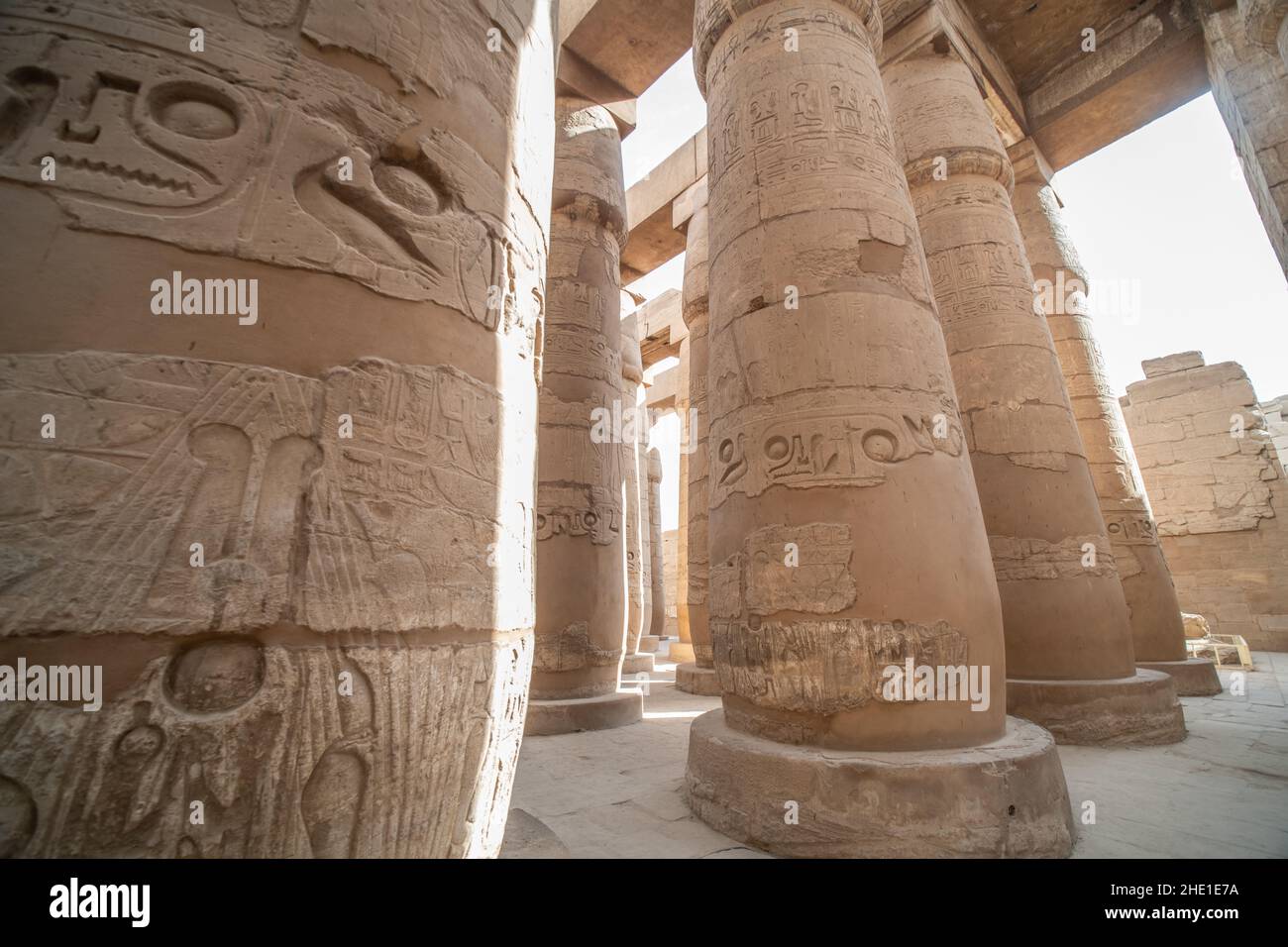 The stone pillars in the Hypostyle hall in Karnak temple, an ancient egyptian archeological site in Egypt. Stock Photo