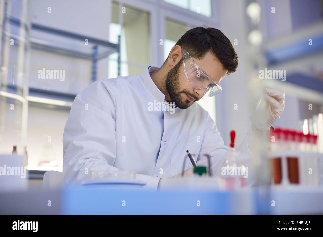Professional man lab assistant do research in laboratory Stock Photo
