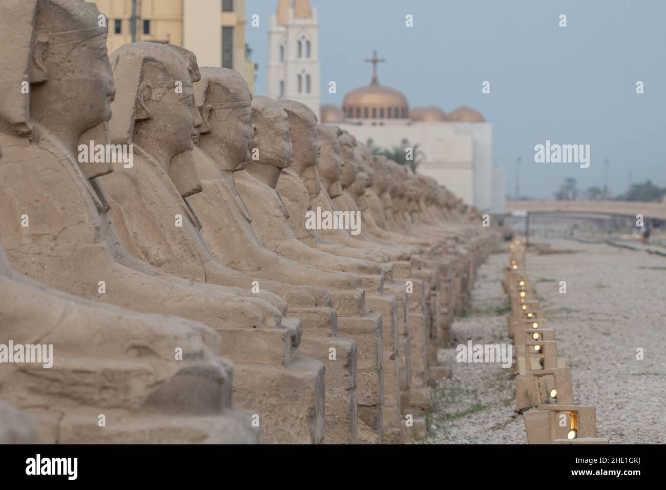 The ancient sphinx statues lining the avenue of sphinxes in Luxor, Egypt the historic road is lined with 100s of stone monuments. Stock Photo