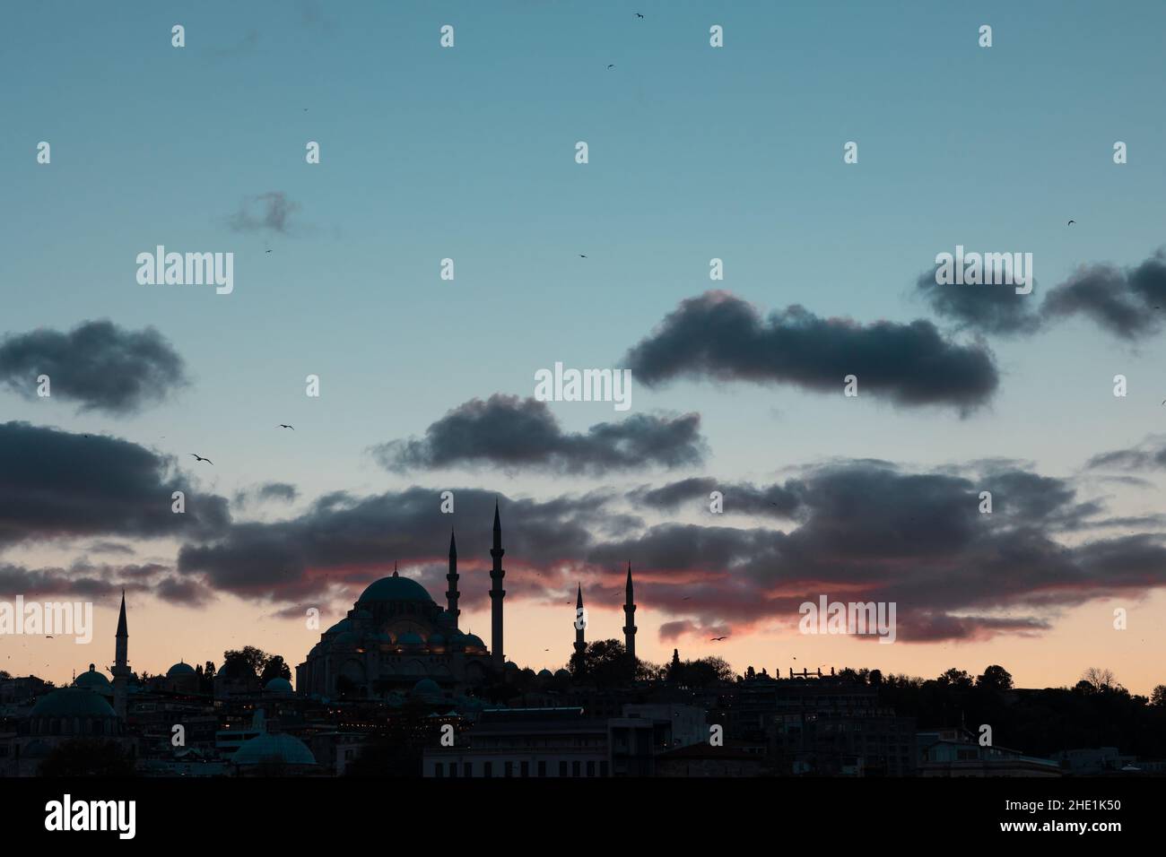Islamic background photo. Suleymaniye Mosque and clouds at sunset. Silhouette of cityscape of Istanbul at sunset. Ramadan or kandil or iftar or islami Stock Photo