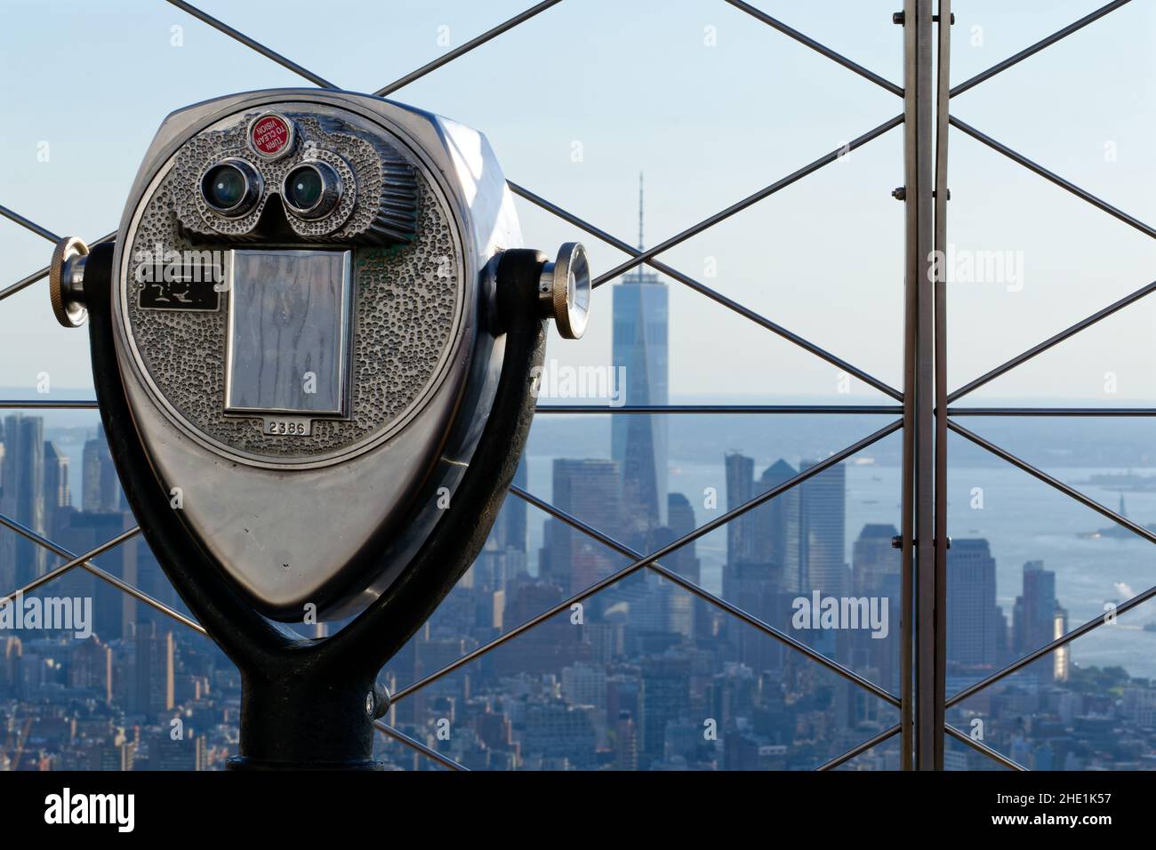 Viewing binoculars wait patiently at the top of the Empire State Building, overlooking Manhattan Island. Stock Photo