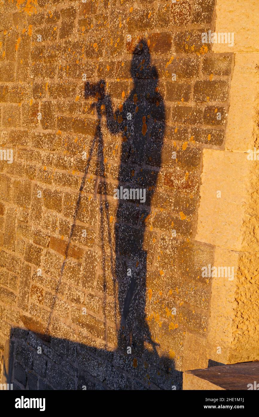 Camera shadow on a stone wall Stock Photo Alamy