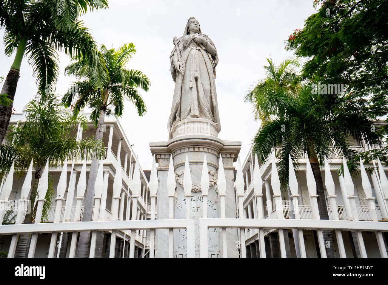 Government House in Port Louis, the capital city of Mauritius. Built by the French in a colonial style, the British put up a statue of Queen Victoria Stock Photo