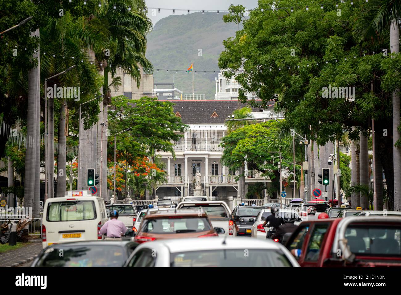 Government House in Port Louis, the capital city of Mauritius. Built by the French in a colonial style, the British put up a statue of Queen Victoria Stock Photo