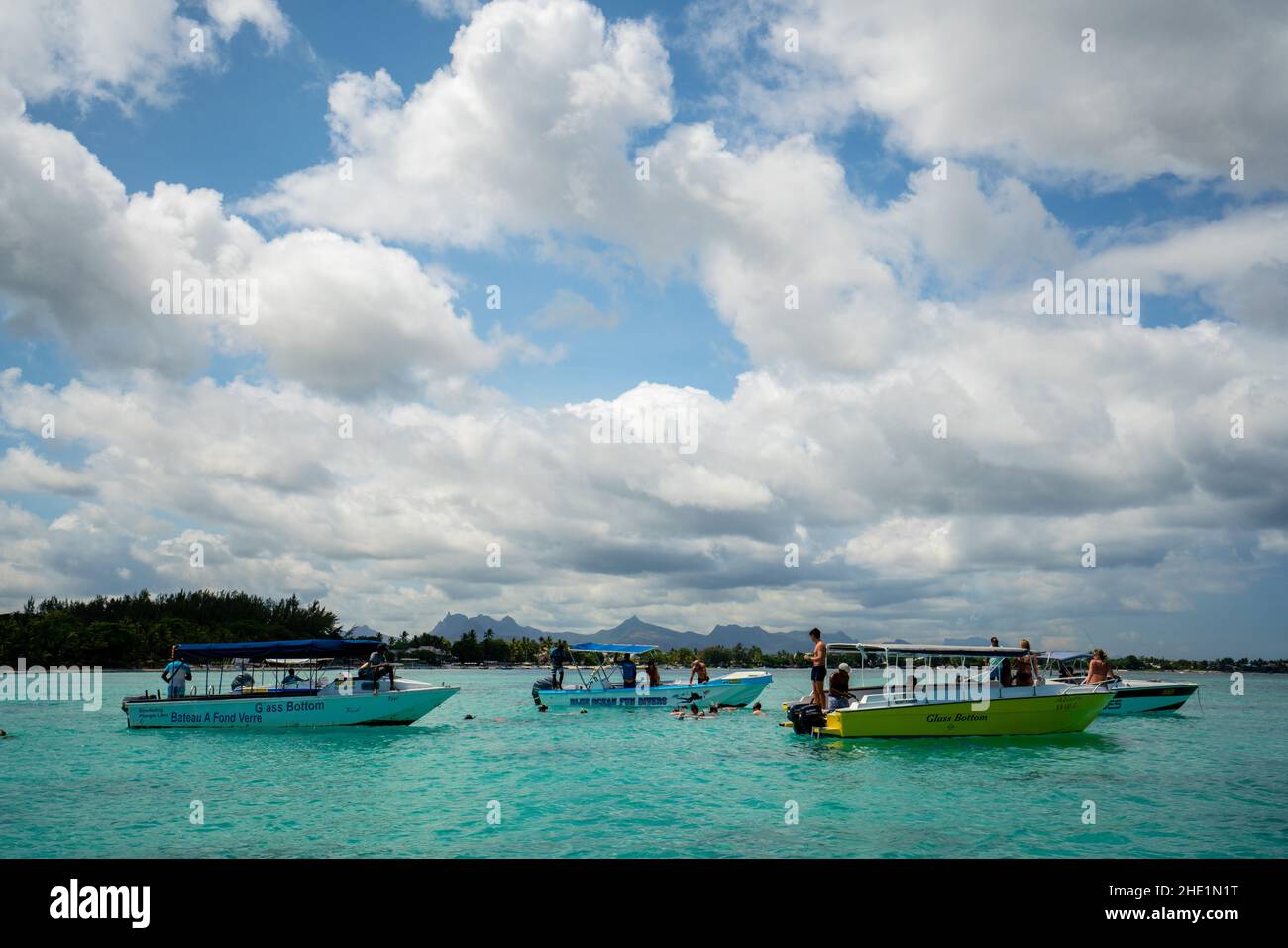 Tourists spotting turtles in the lagoon surrounding Mauritius Stock Photo