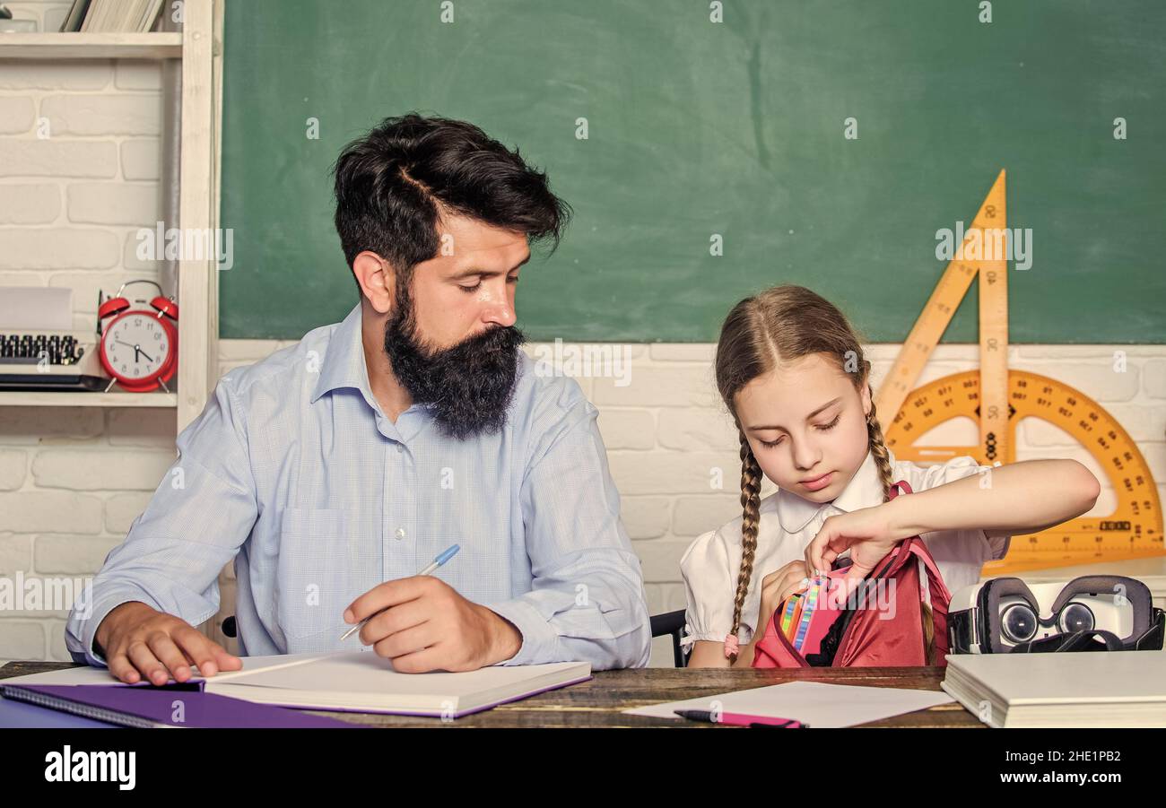 Study is fun. School teacher and schoolgirl. Homeschooling with father ...