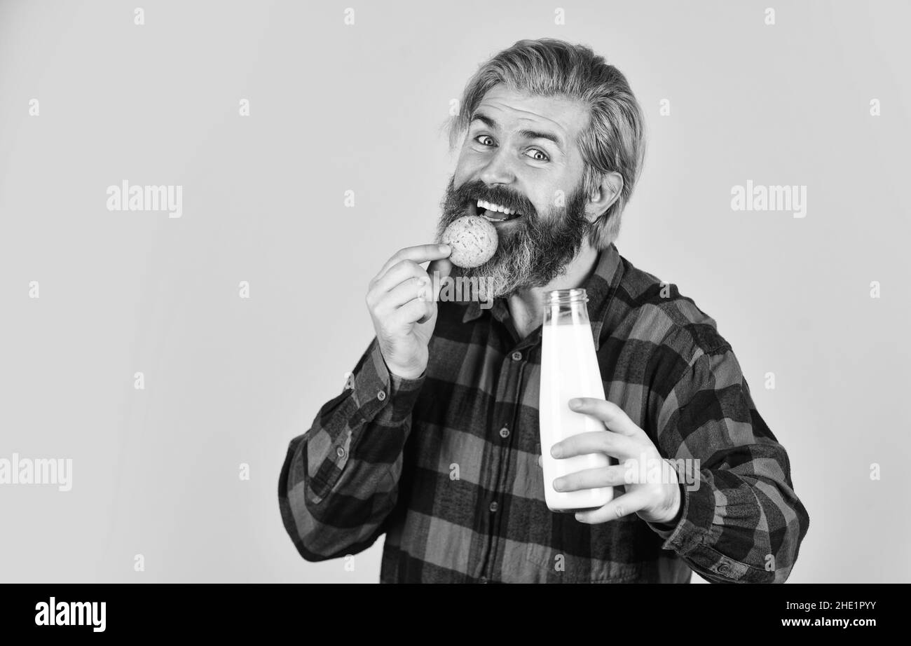 Man eating cupcake Black and White Stock Photos & Images - Alamy