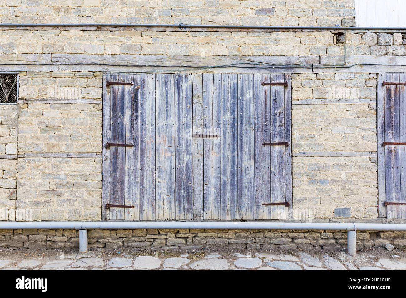 Old window closed with wooden shutters Stock Photo - Alamy