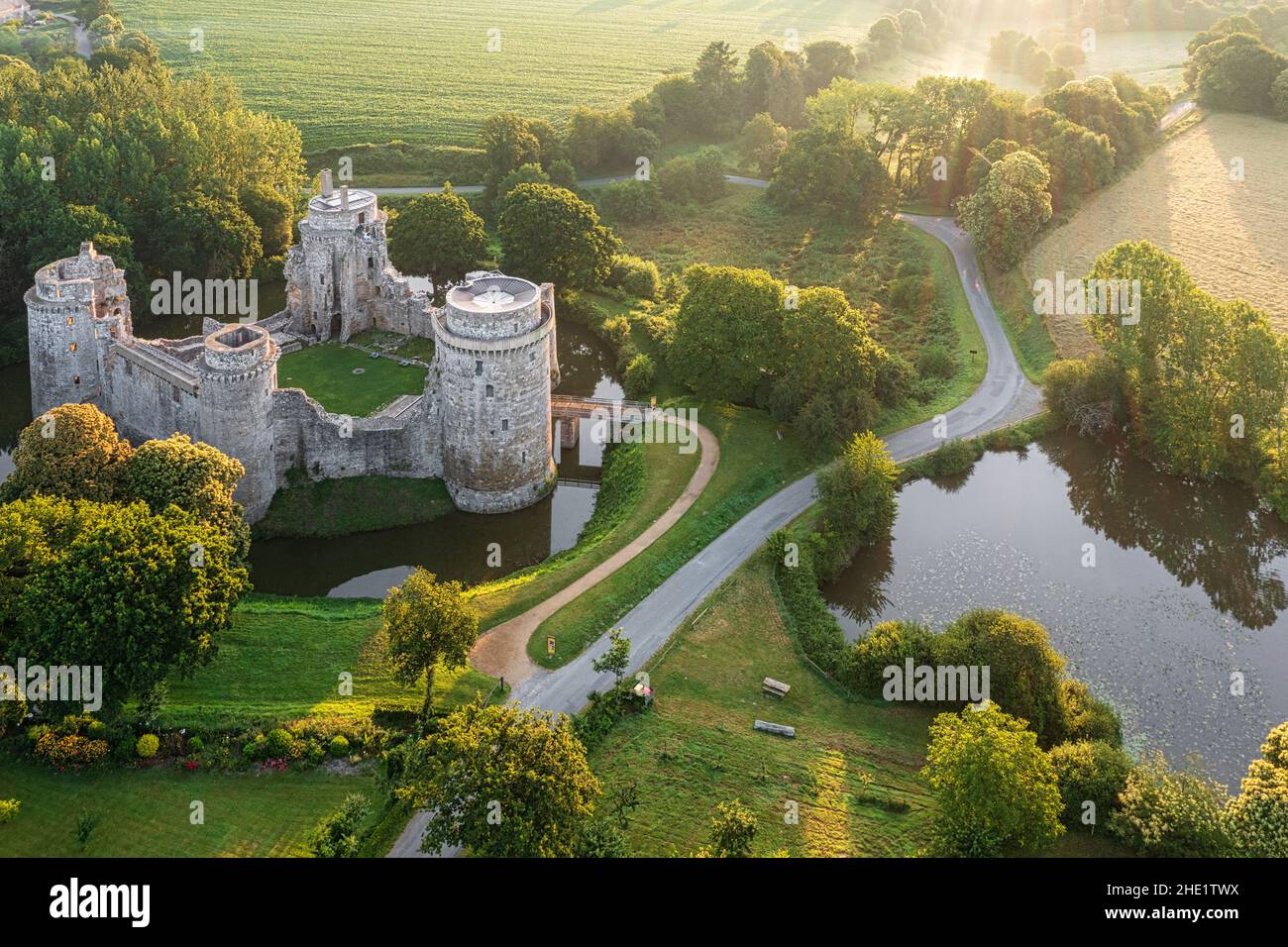 Aerial view of the ruins of the Hunaudaye castle in Cotes d'Armor, Brittany, France, in sunrise light Stock Photo