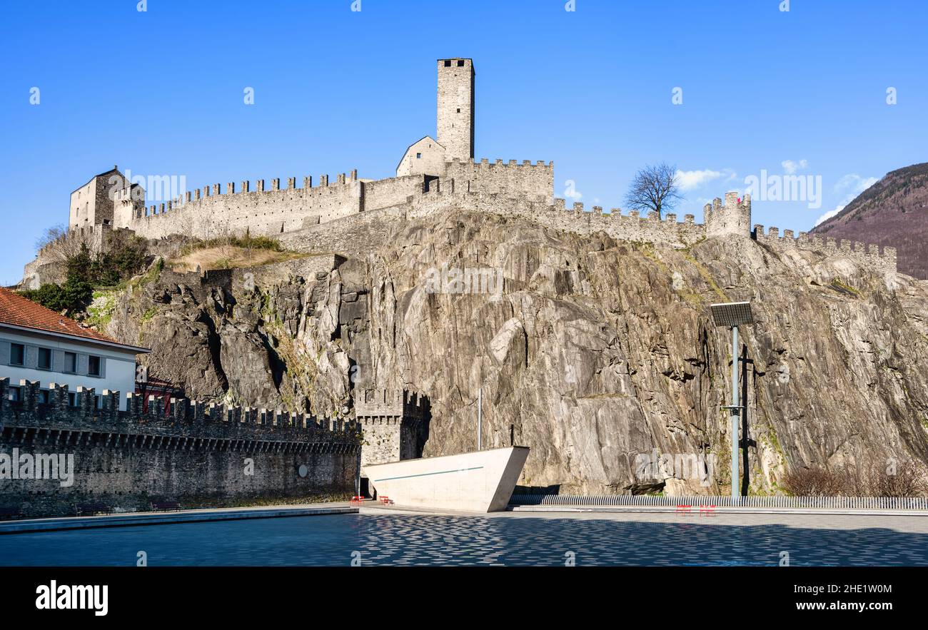Walls and towers of medieval Castelgrande castle on a rocky hill in Bellinzona Old town center, Switzerland Stock Photo