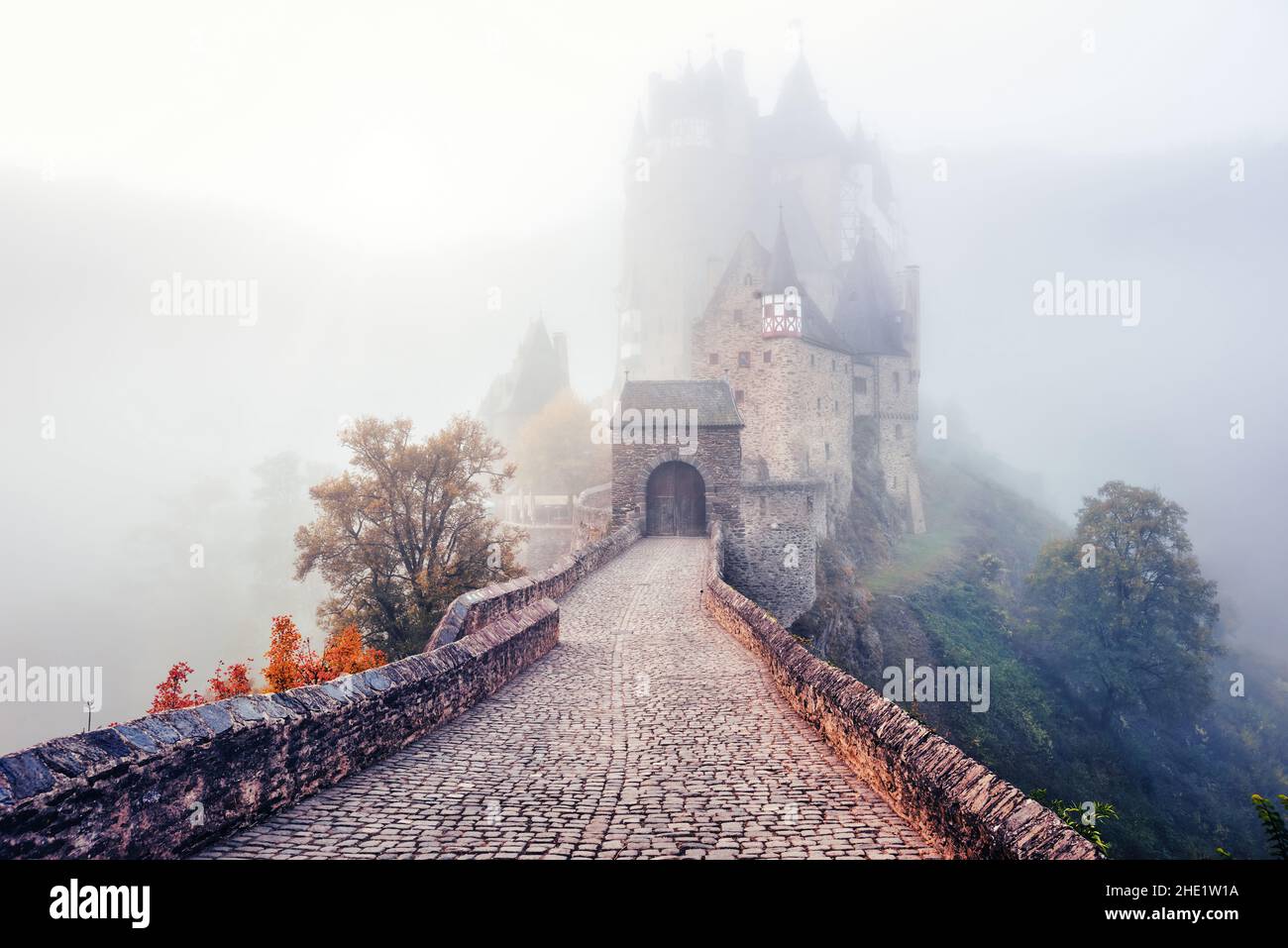 Historical Burg Eltz castle, Moselle river valley, Germany, in a cloud of mist on a cold autumn day Stock Photo