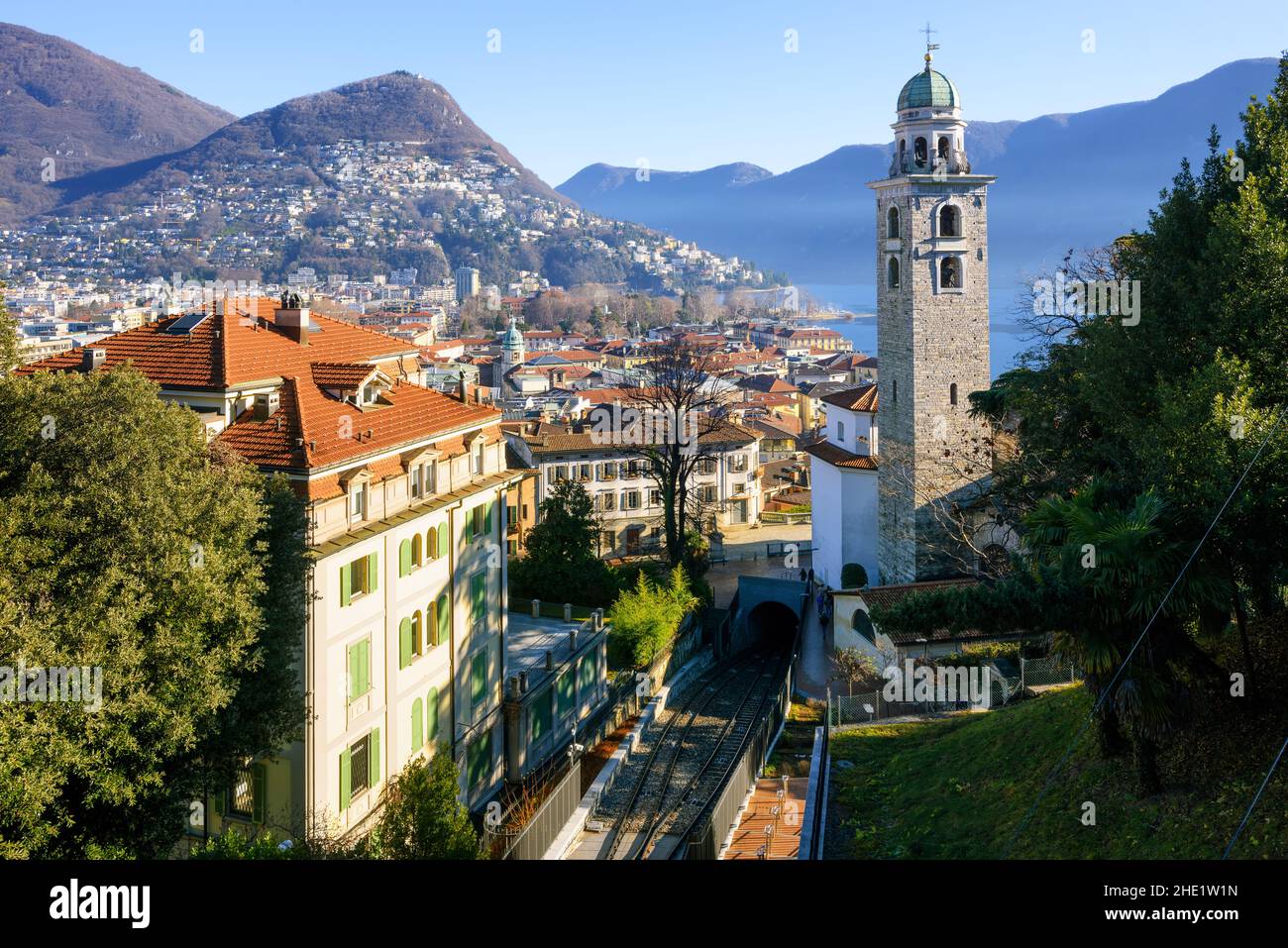 Lugano cityscape, view of the Cathedral, Lake Lugano, Monte Bre and the Alps mountains, Switzerland Stock Photo